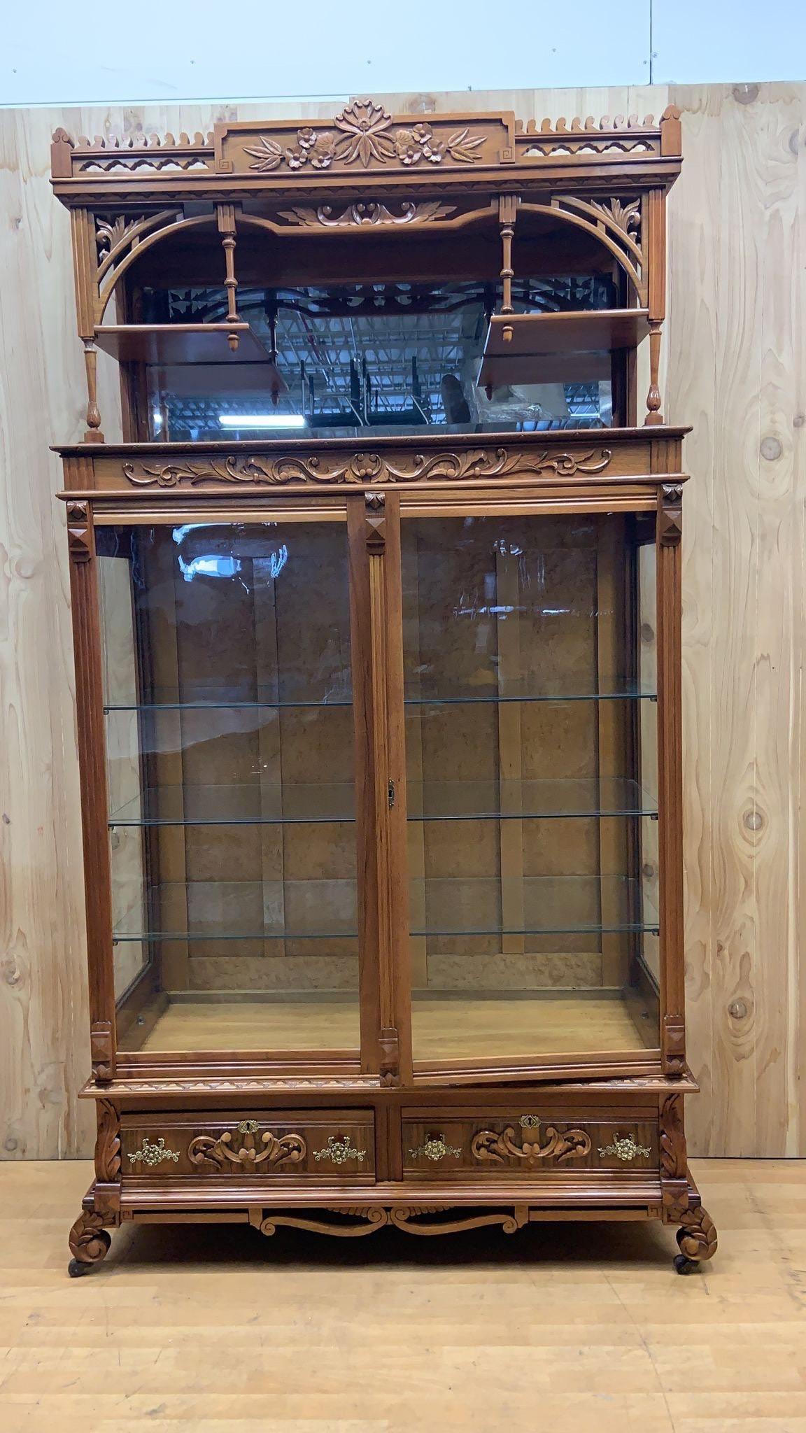 Antique Eastlake Ornate Carved Walnut Double Glass-Door Bookcase/Display cabinet

Exquisite 19th Century Tall, Victorian, Finely Carved & Detailed Double Glass-Door Front Eastlake Bookcase/Display Cabinet. This Gorgeous Piece Features 3 Glass
