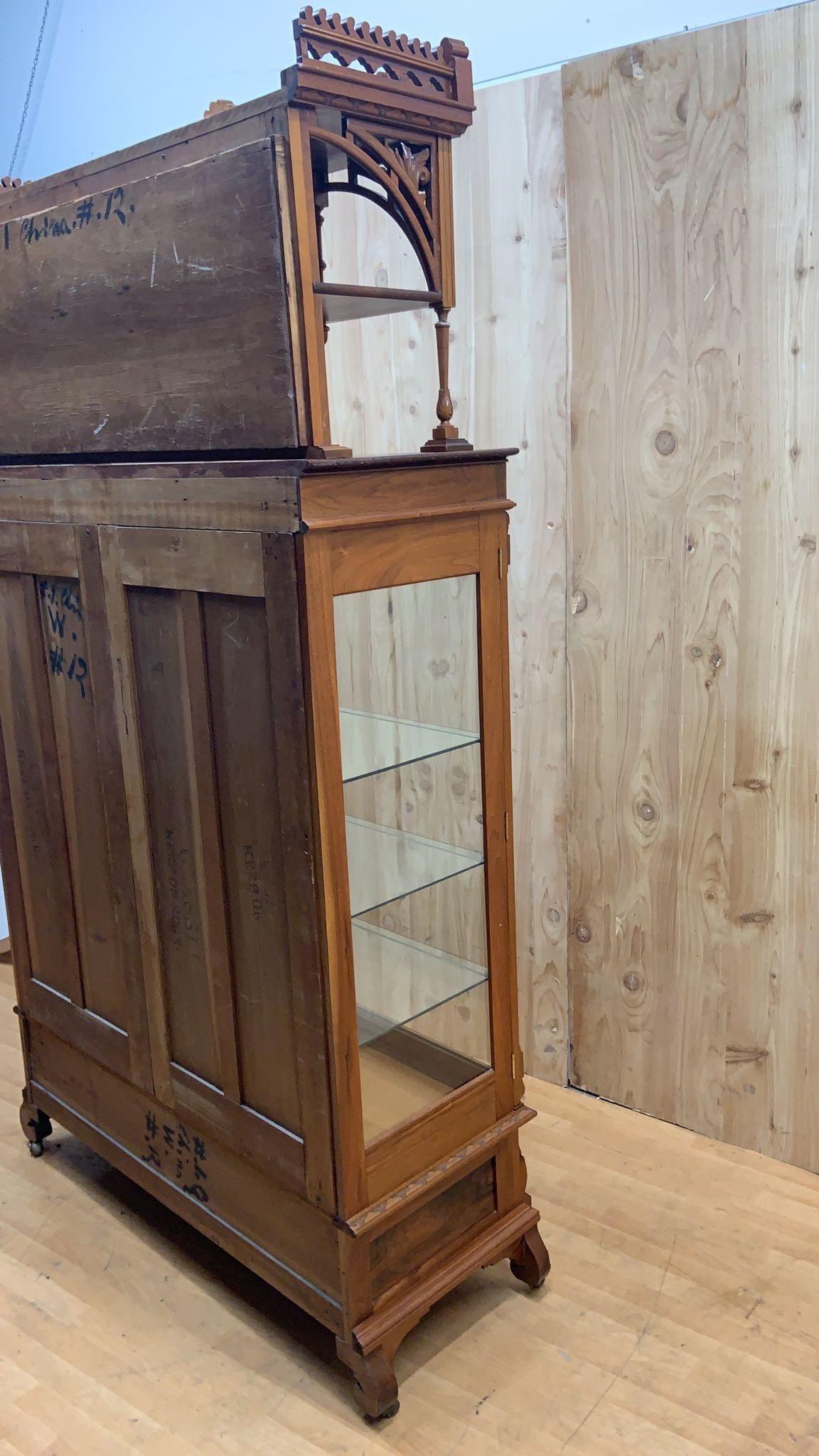 antique curio cabinet with glass doors