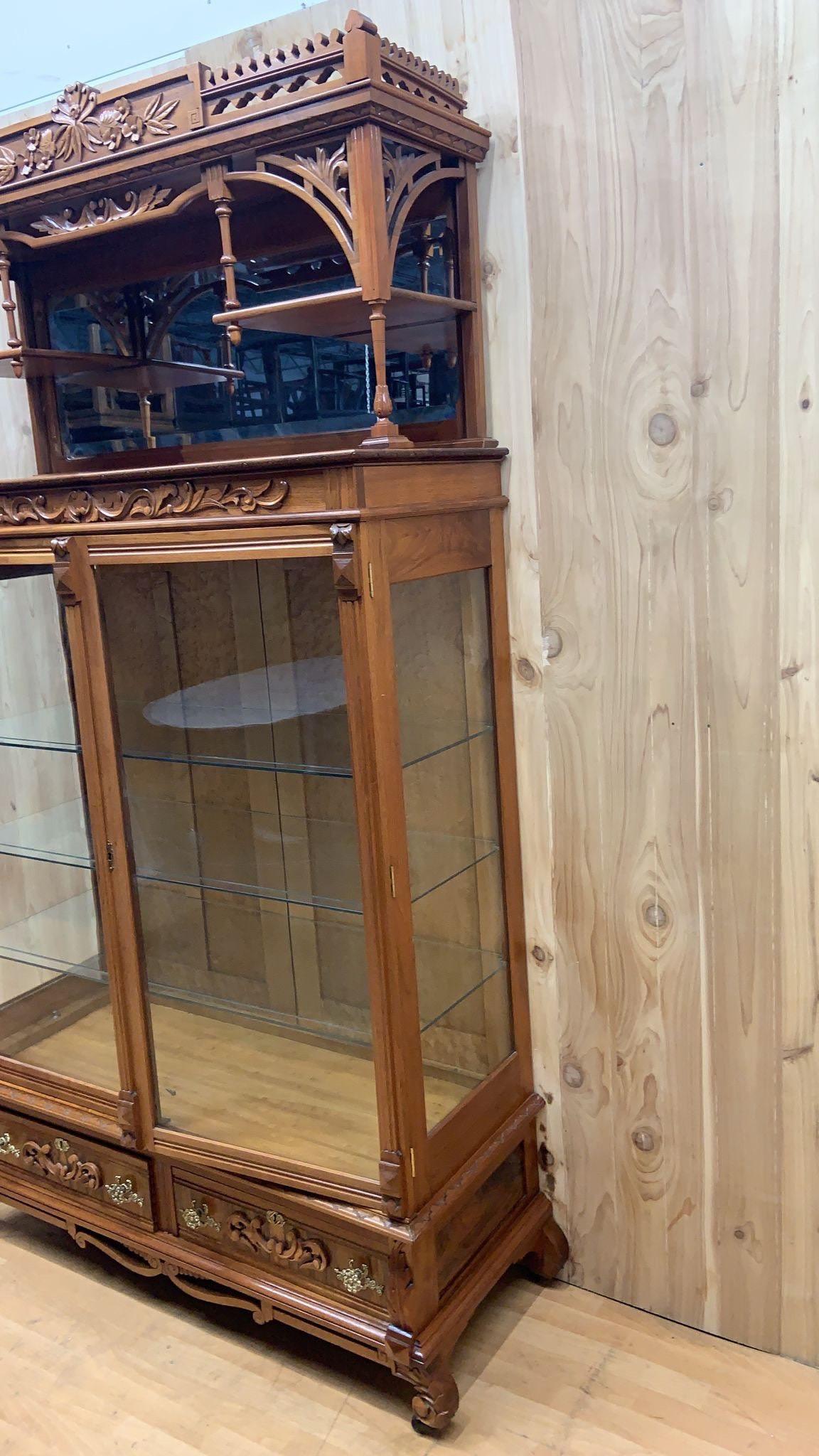 tall antique cabinet with glass doors