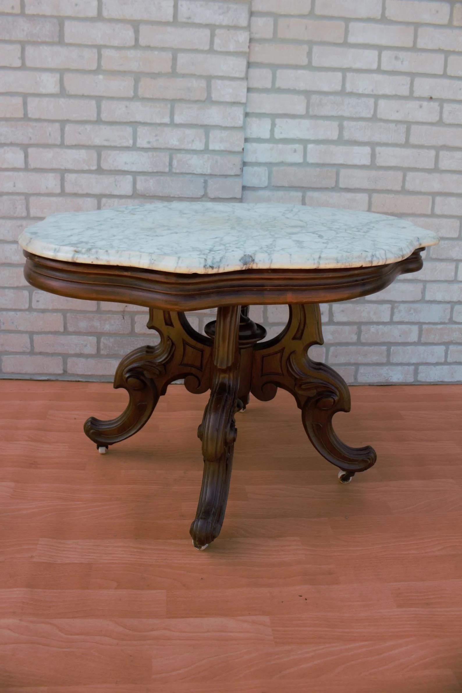 Antique Eastlake Style Coffee Side Table with Carrara Marble Top

This antique Eastlake style coffee/side table features a stunning Carrara marble top, complemented by a carved base that showcases intricate detailing. The addition of casters