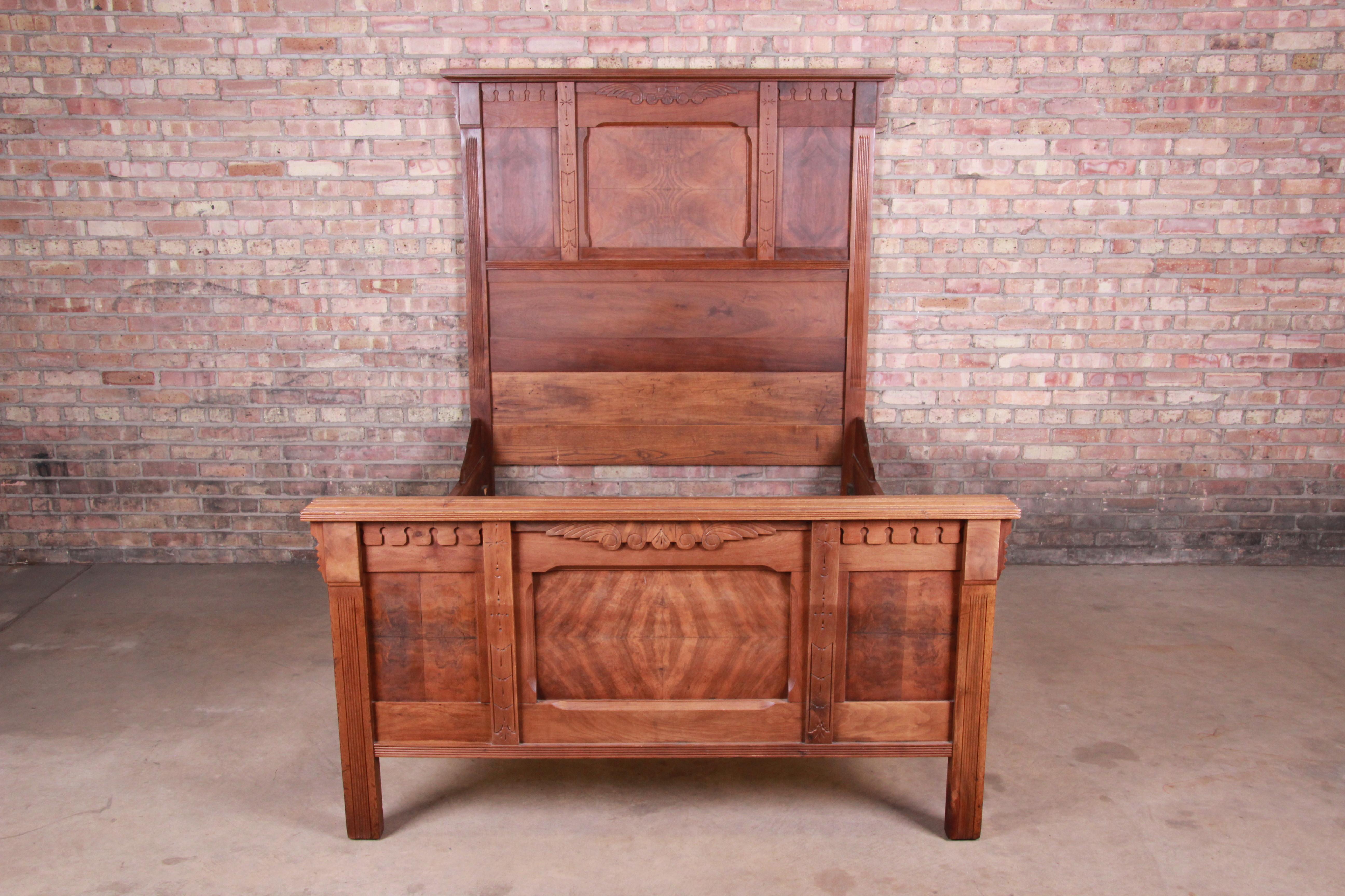 A gorgeous Victorian Eastlake burled walnut full size bed frame

USA, circa 1880s

Measures: 60