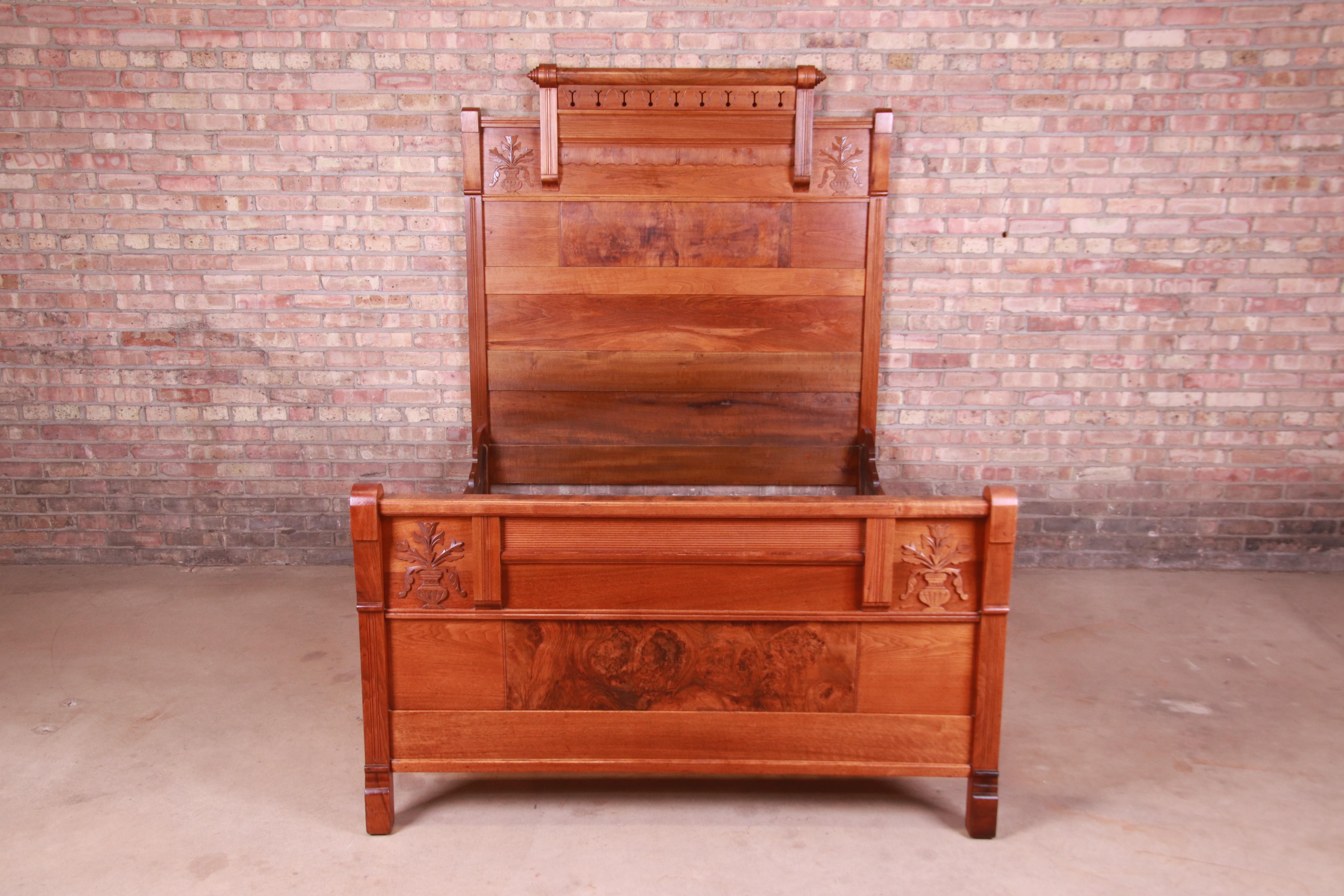 A gorgeous Victorian Eastlake full size bed frame

USA, Circa 1880s

Carved walnut, with inset burled walnut panels.

Measures: 57.75