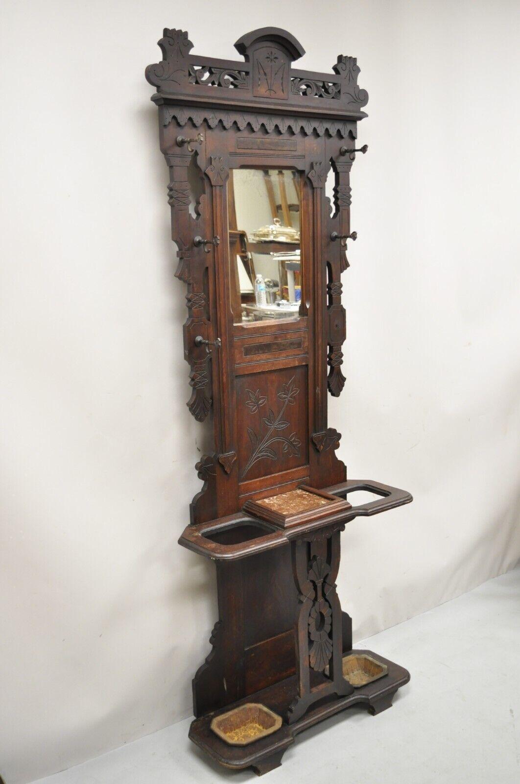 Antique Eastlake Victorian Carved Walnut Hall Tree Coat Stand. Item features central 