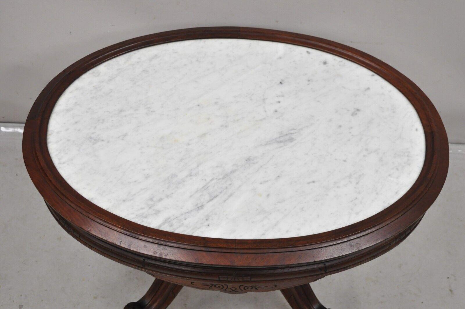 Antique Eastlake Victorian Carved Walnut Oval Marble Top Parlor Coffee Table In Good Condition For Sale In Philadelphia, PA