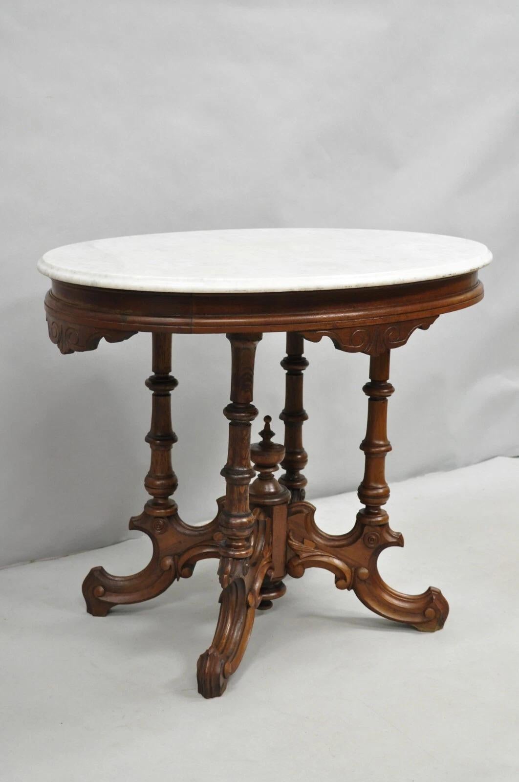 Antique Eastlake Victorian Carved Walnut Pedestal Base Marble Top Parlor Table. Circa Late 19th Century. Measurements: 28