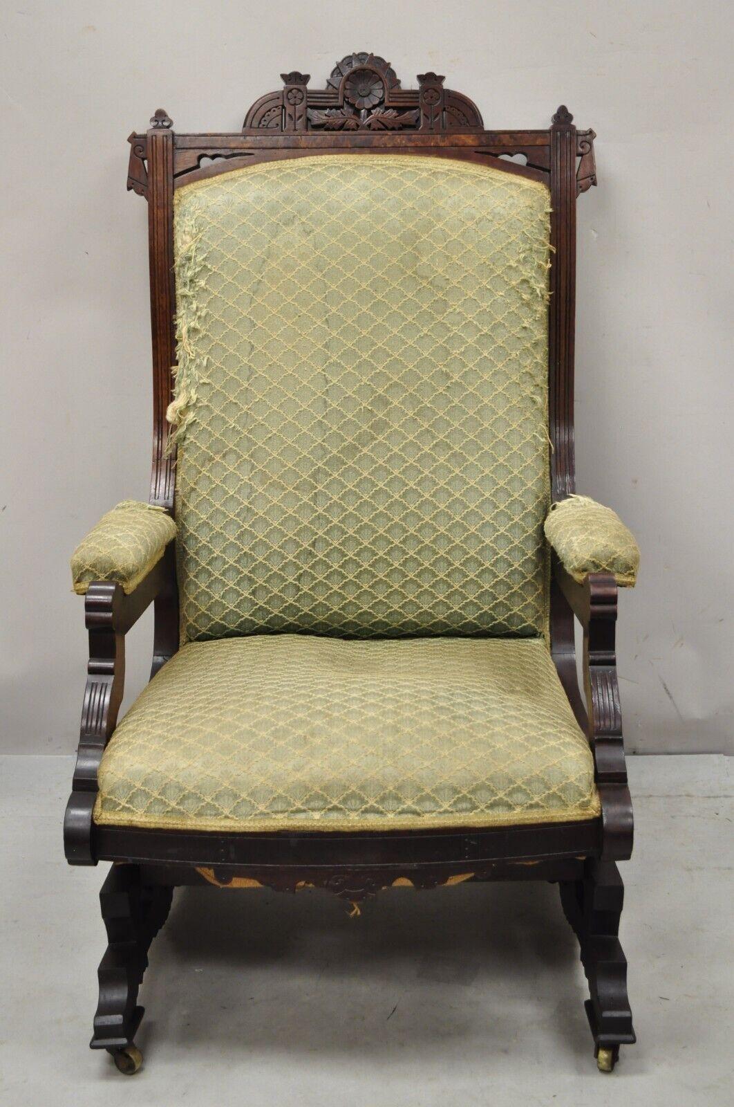 Antique Eastlake Victorian Carved Walnut Platform Rocker Rocking Chair. Item features Rolling casters, solid wood frame, beautiful wood grain, nicely carved details, very nice antique item. Circa 19th Century. Measurements: 41.5