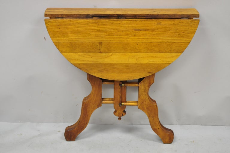 Antique Eastlake Victorian Folding Dropleaf Napkin Card Game Oak Dining Table In Good Condition For Sale In Philadelphia, PA