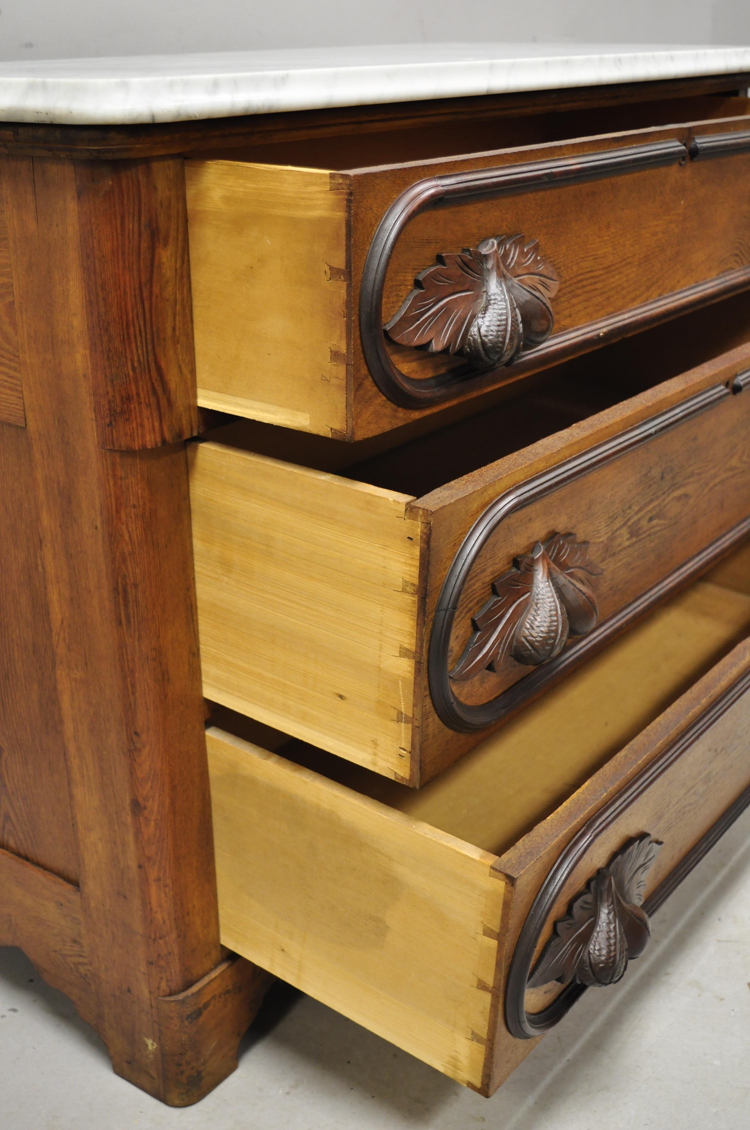 North American Antique Eastlake Victorian Marble Top Chestnut Dresser with Fruit Carved Pulls