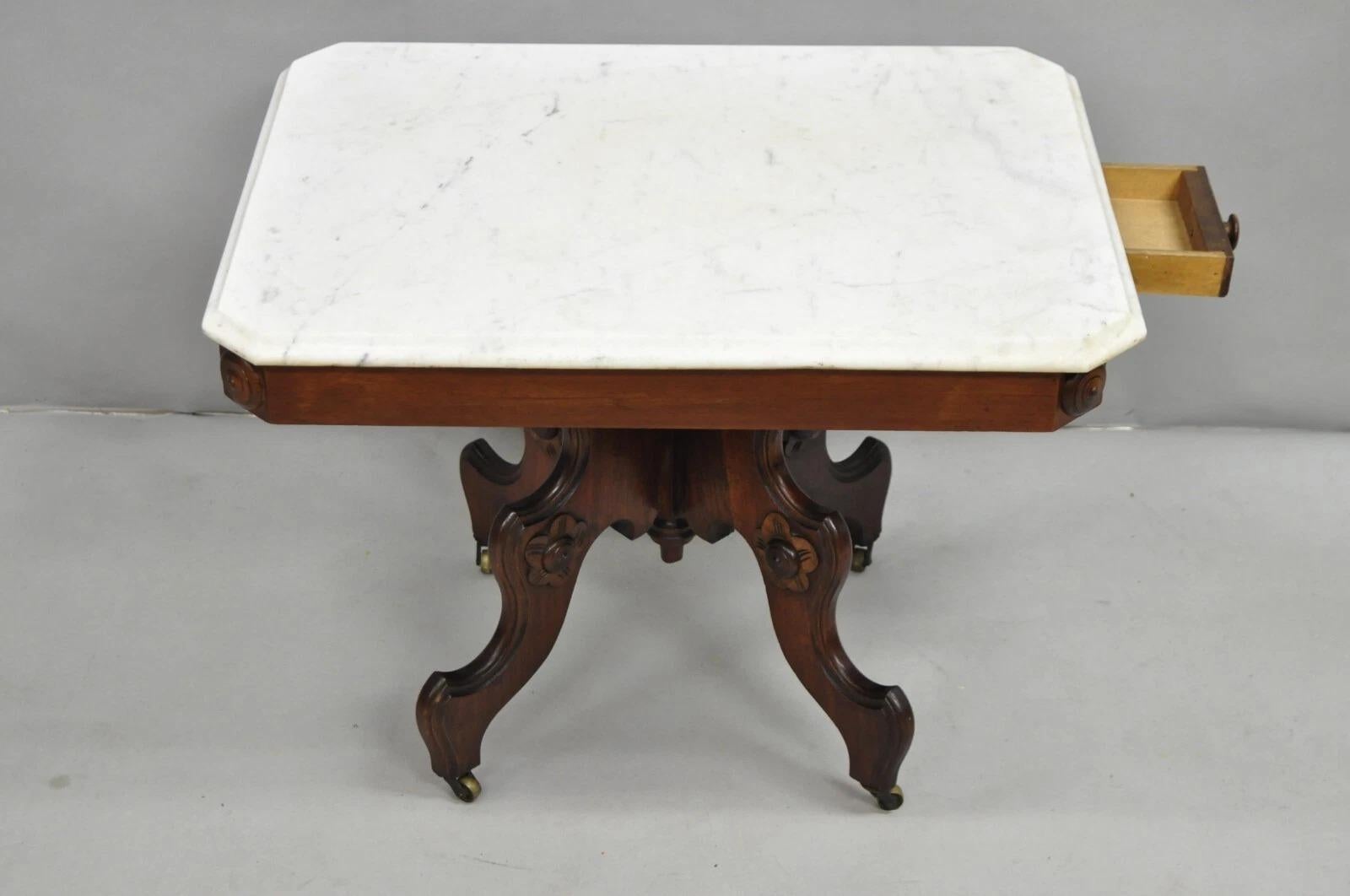Antique Eastlake Victorian Small Marble Top Pedestal Base Coffee Table with Small Side Drawer. Circa Late 19th Century. Measurements: 20.5