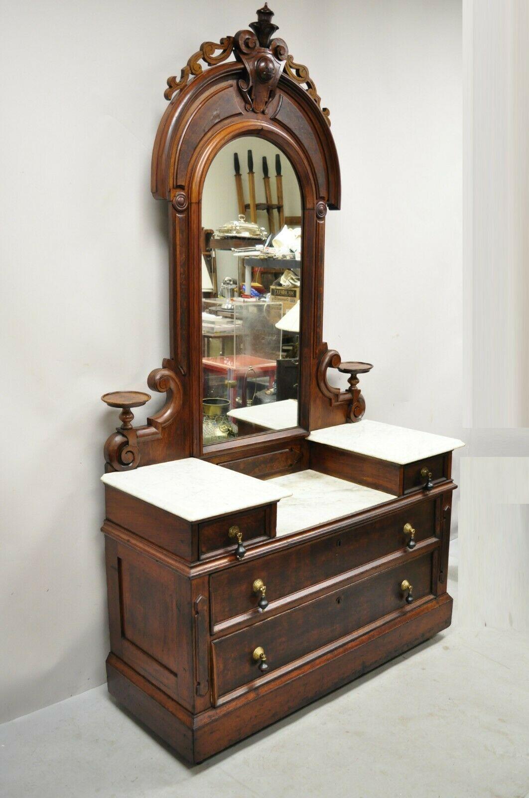 Antique Eastlake Victorian walnut 3 marble tier dresser with tall mirror. Item features (3) Marble tops, vanity mirror with carved pediment, no key, but unlocked, very nice antique item, great style and form. Circa Late 19th Century. Measurements: