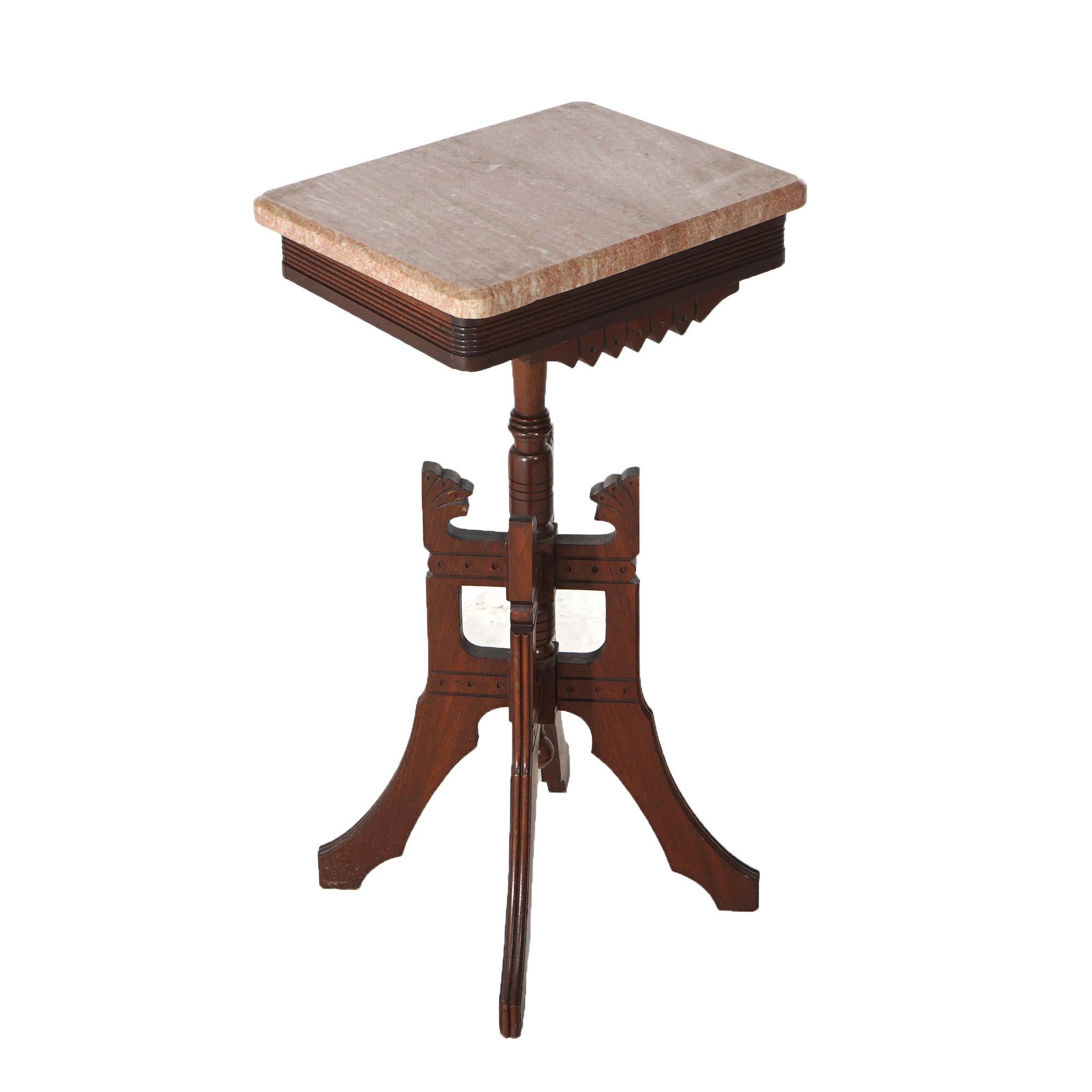 An antique Eastlake side stand offers marble top over incised decorated walnut base having shaped skirt and raised on stylized legs, c1890

Measures- 29.75''H x 15.25''W x 12''D
