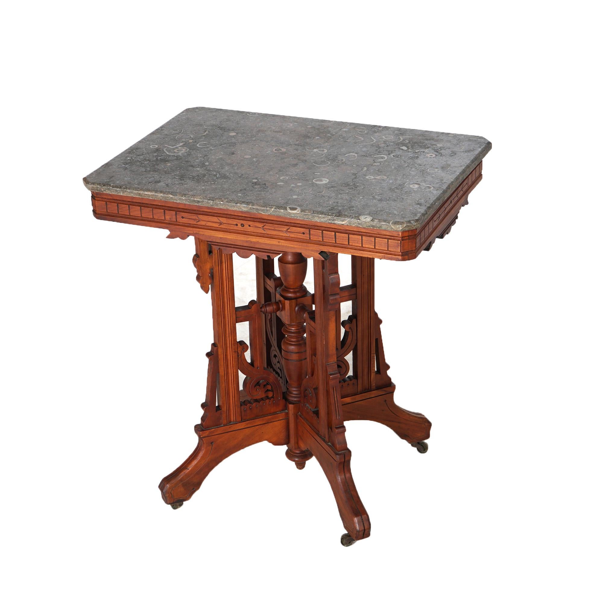 ***Ask About Discounted In-House Shipping***
An antique Eastlake side stand offers marble top over carved walnut base having incised decoration, stylized drop finials, and four legs with a central turned column, c1890

Measures- 30''H x 28''W x 20''D