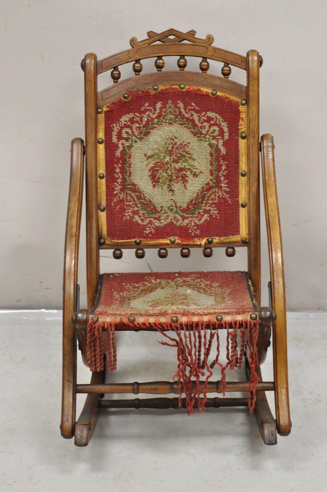 Antique Eastlake Victorian Walnut Small Child's Folding Rocker Rocking Chair. Item features a unique folding frame. Very nice child's chair. Circa 19th Century.
Measurements: 
Folded: 31
