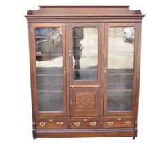 Antique Eastlake Victorian Walnut Wavy Glass Triple Bookcase Display Cabinet