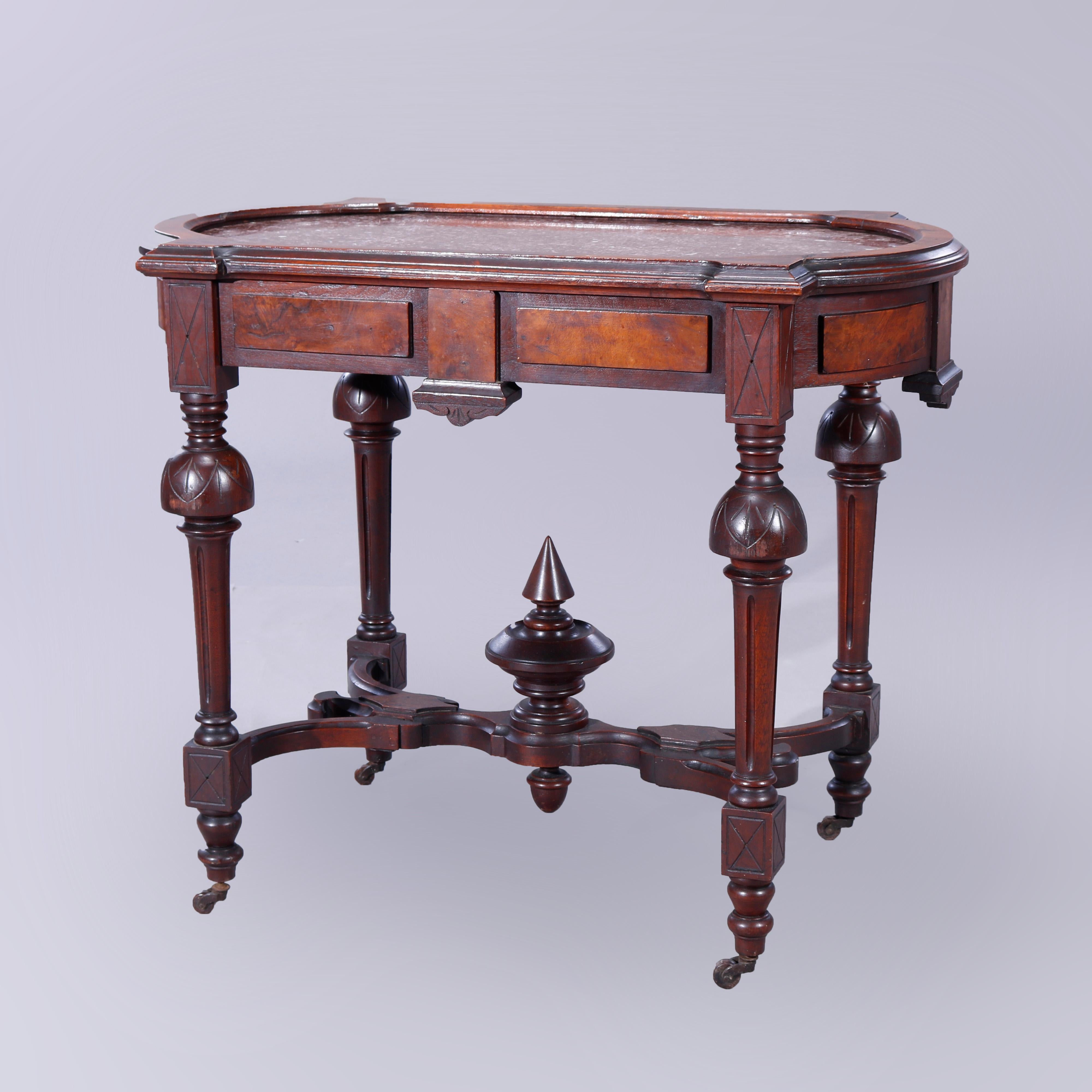 An antique Eastlake parlor table offers rouge marble seated in picture frame top having burl inlaid skirt, raised on turned balustrade legs with shaped stretcher having central finial, c1880.

Measures - 30.75''H x 37.25''W x 22''D.

Catalogue Note:
