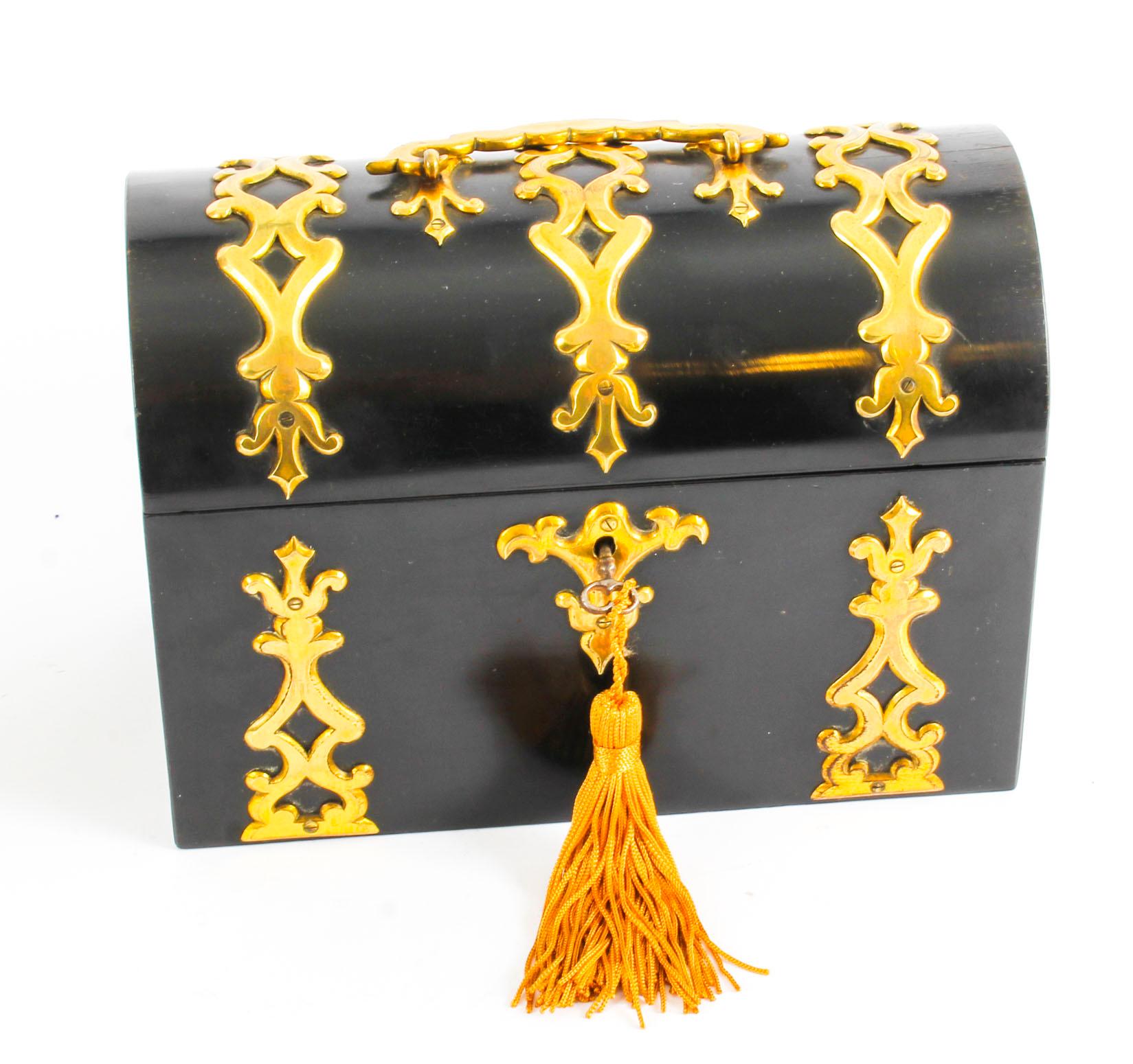 This is a wonderful antique ebonised and cut card brass casket shaped stationary box, circa 1860 in date.

It bears the brass label of the highly sought after jewellers and silversmiths Howell James & Co. of Regent Street, London.

This