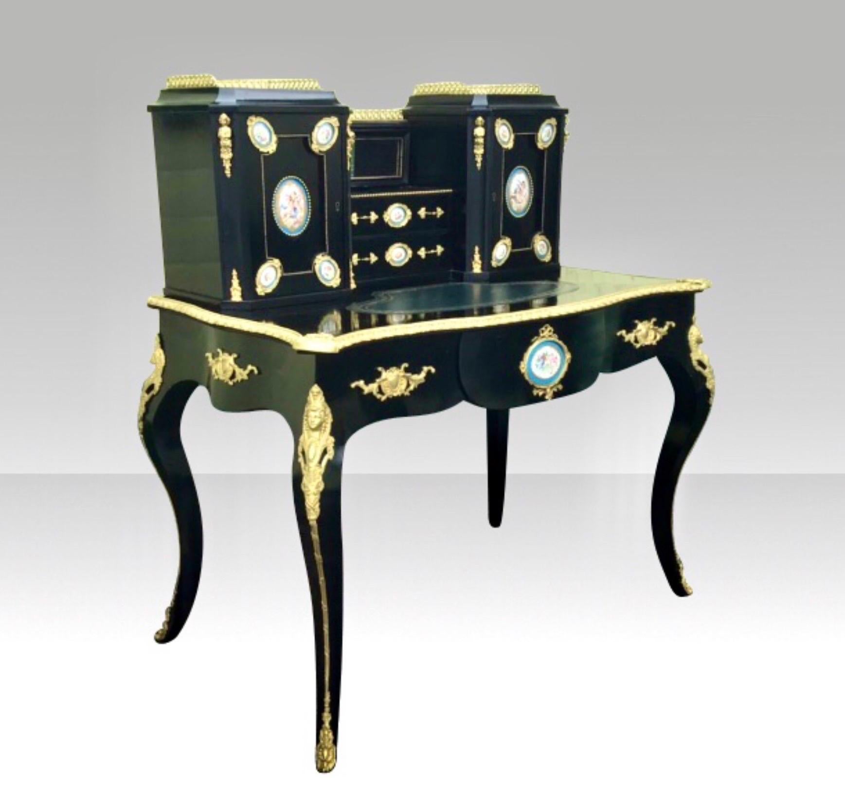 A fine 19th century Antique ebonised Bon-heur Du Jour desk, with hand painted porcelain panels and Quality Ormolu Mounts.
 Stamped Edwards & Roberts London.
Fabulous condition!
Replaced tooled Blue Leather Skiver.
c1880 
Measures: 43 in x 26 in