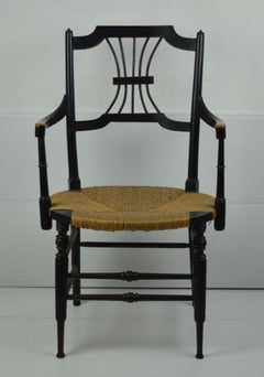 Chaise ancienne à assise en jonc ébénisterie conçue par Dante Gabriel Rossetti