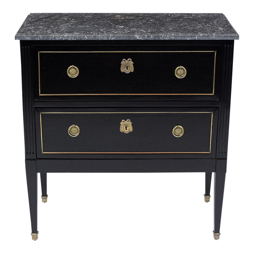 This Late 19th Century Louis XVI Dresser is made out of mahogany wood and has been completed restored. This French commode features a new rich ebonized color stain with a lacquered finish and the original dark grey color marble-top with beveled edge