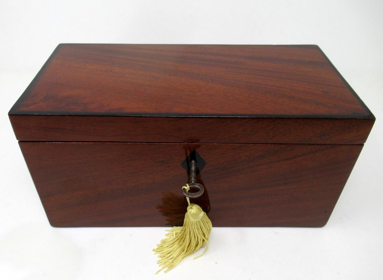 A superb example of an English late Regency period well grained flame mahogany double interior section tea caddy of rectangular outline and outstanding quality, the hinged lid with inlaid edging of ebony stringing, complete with original working