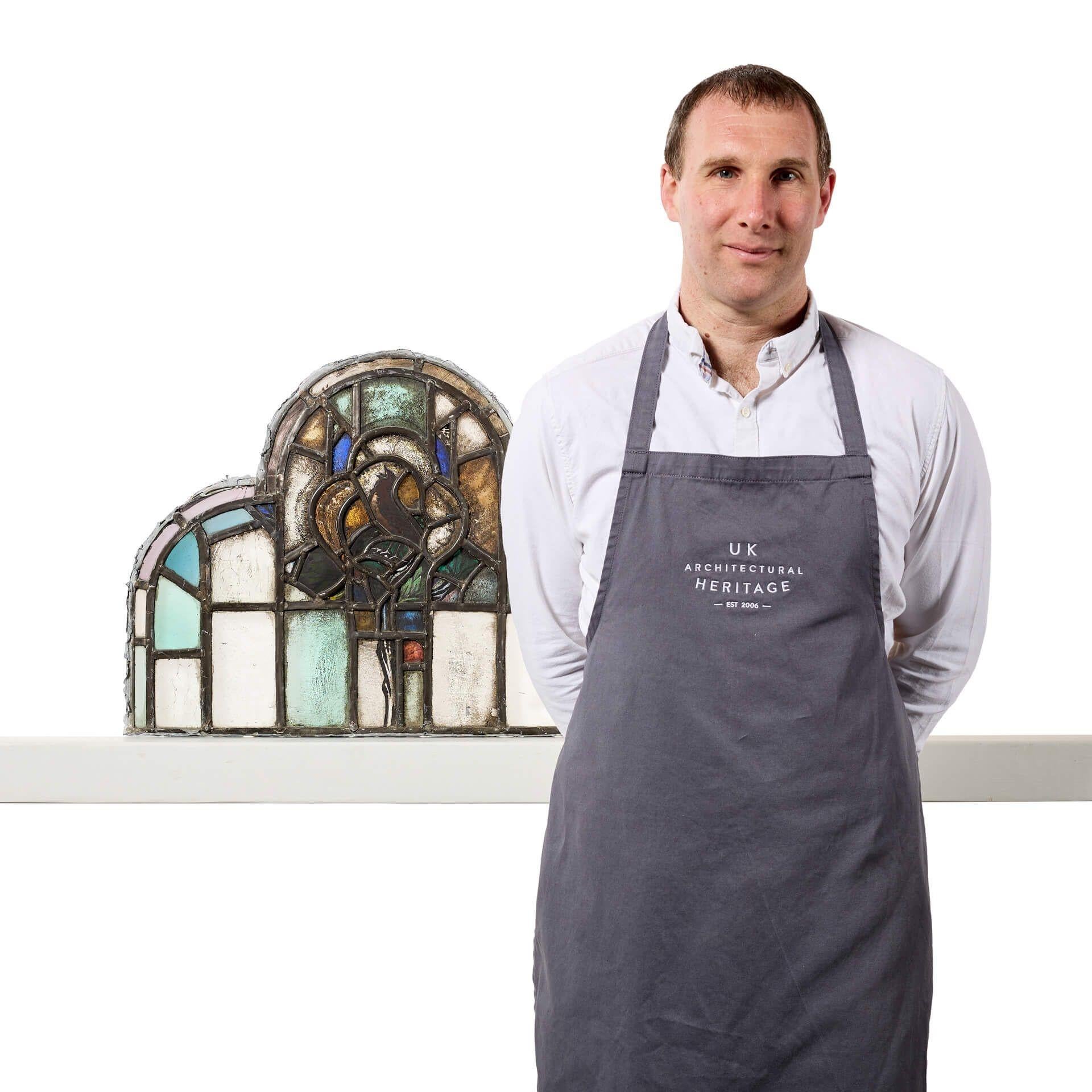 A unique antique ecclesiastical multi-arched stained glass panel depicting a stylised song bird.

Though it dates from the early 20th century, this will make a stunning feature above a porch or dividing door in properties traditional and modern
