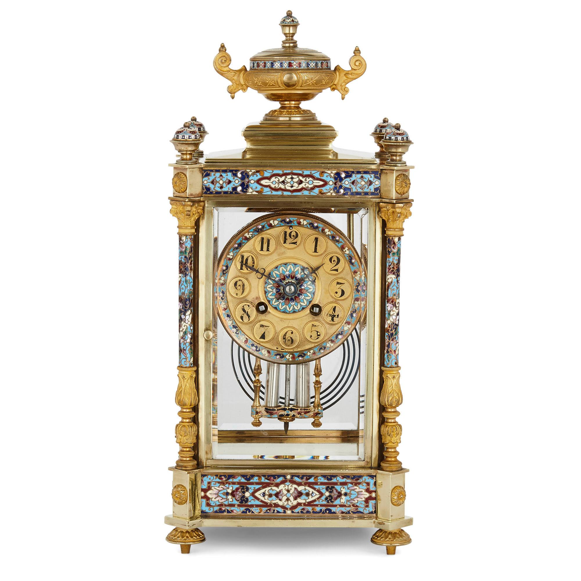 Antique Eclectic style gilt bronze, brass and champlevé enamel mantel clock
French, late 19th century
Dimensions: Height 37cm, width 17cm, depth 15cm

This unusual mantel clock is designed in the eclectic late 19th century French style,