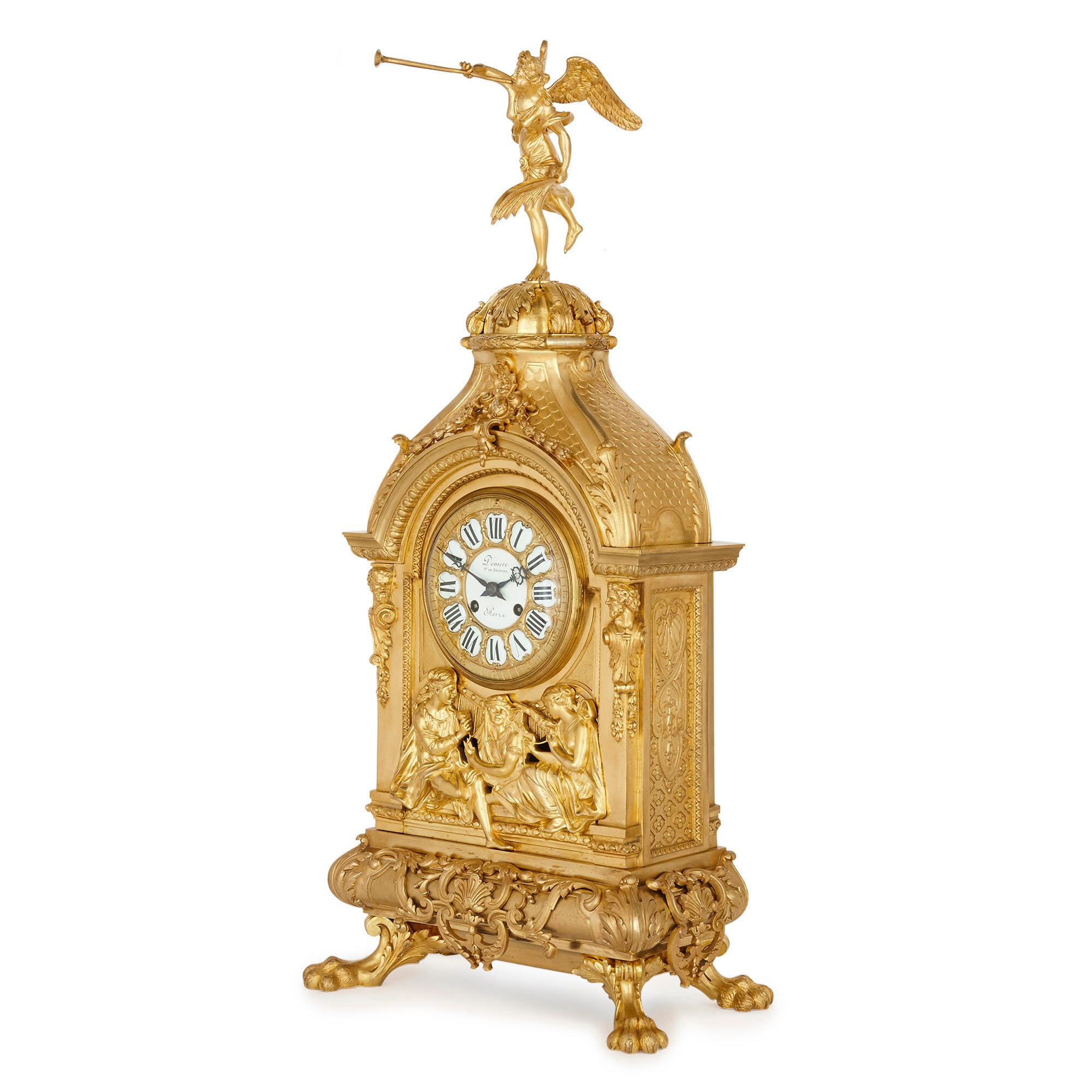 Antique eclectic style gilt bronze clock set by Henri Picard and Denière et Fils
French, late 19th century
Dimensions: Clock height 78cm, width 36cm, depth 24cm, candelabra height 76cm, width 37.5cm, depth 29cm

This fine three-piece clock set