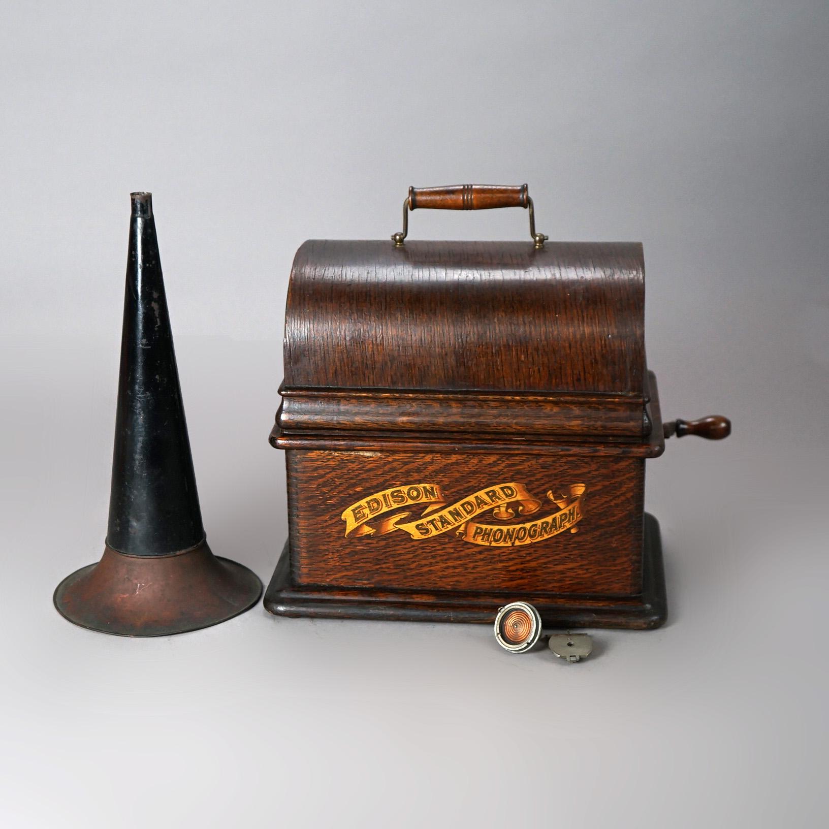 An antique Edison Standard Cylinder Phonograph offers oak case with original maker label as photographed and exterior horn, working condition, c1905

Measures - 21.75
