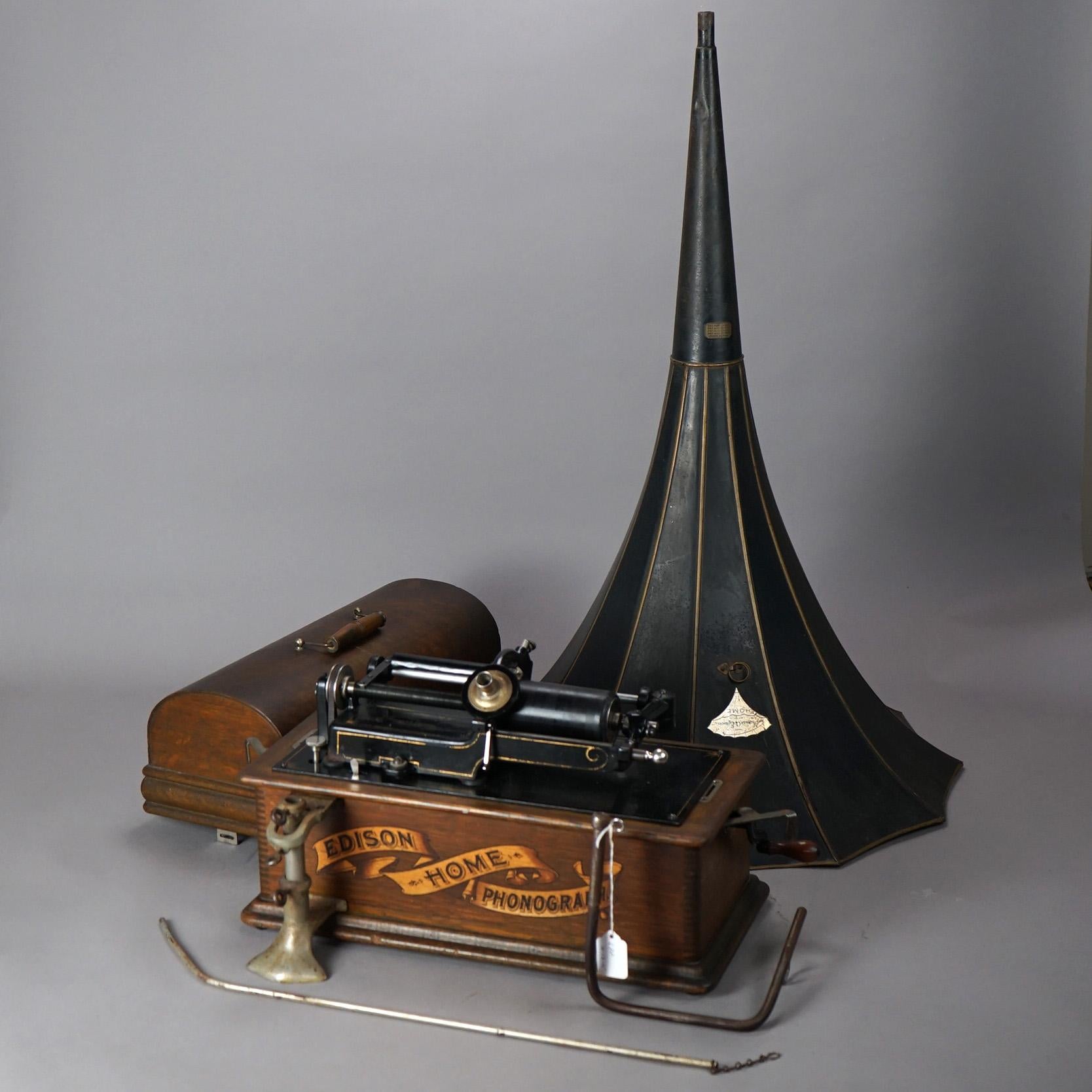 An antique Edison Home Standard Phonograph offers oak case with maker label and exterior horn, working condition (horn does not fit properly into base), c1905

Measures - 33