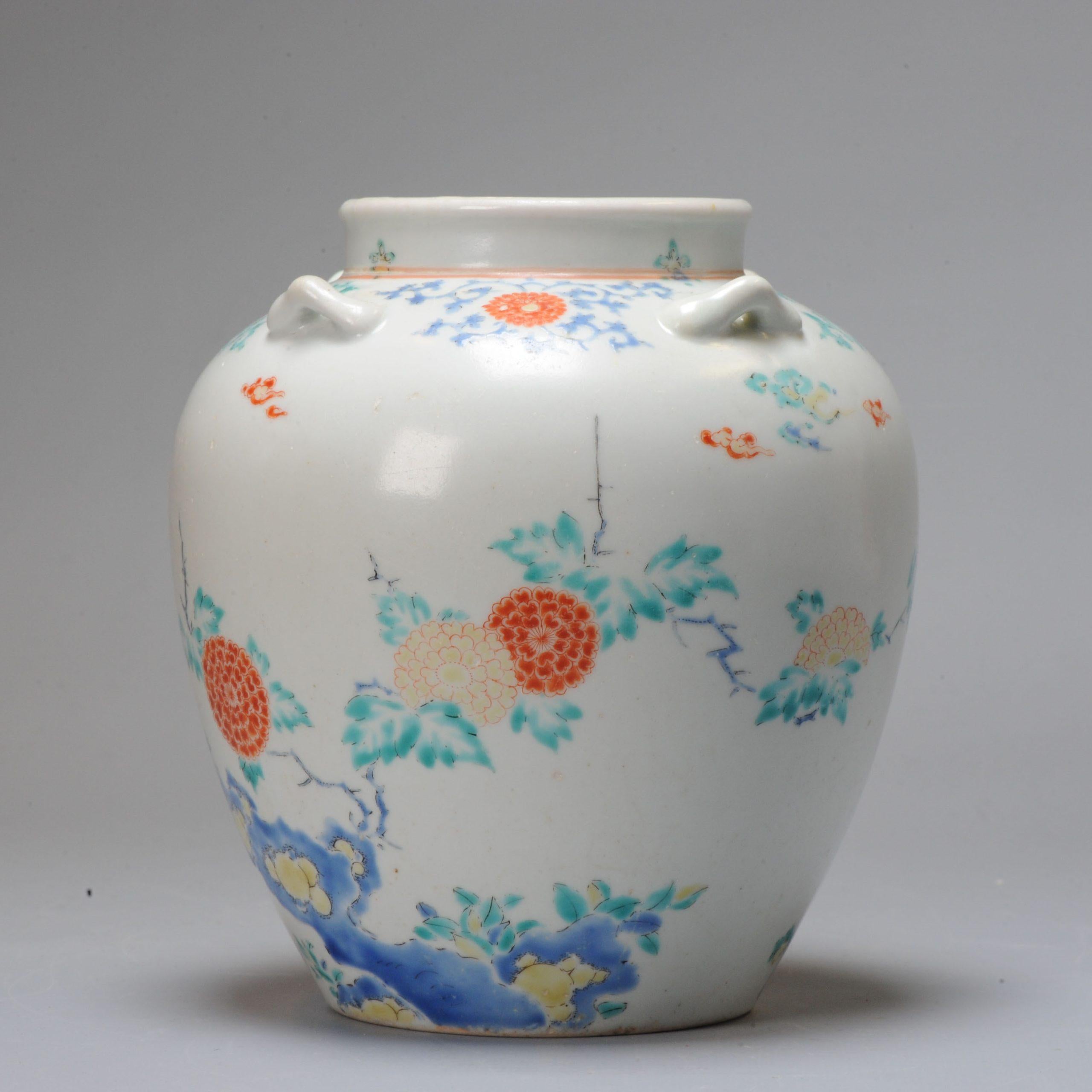 A Kakiemon jar with handles
Edo period (late 17th century)
The Jar or pot is of great and delicate shape and decorated in iron-red, blue, green and yellow enamels with different kind of flowers, rocks, clouds and karakusa.
With matching