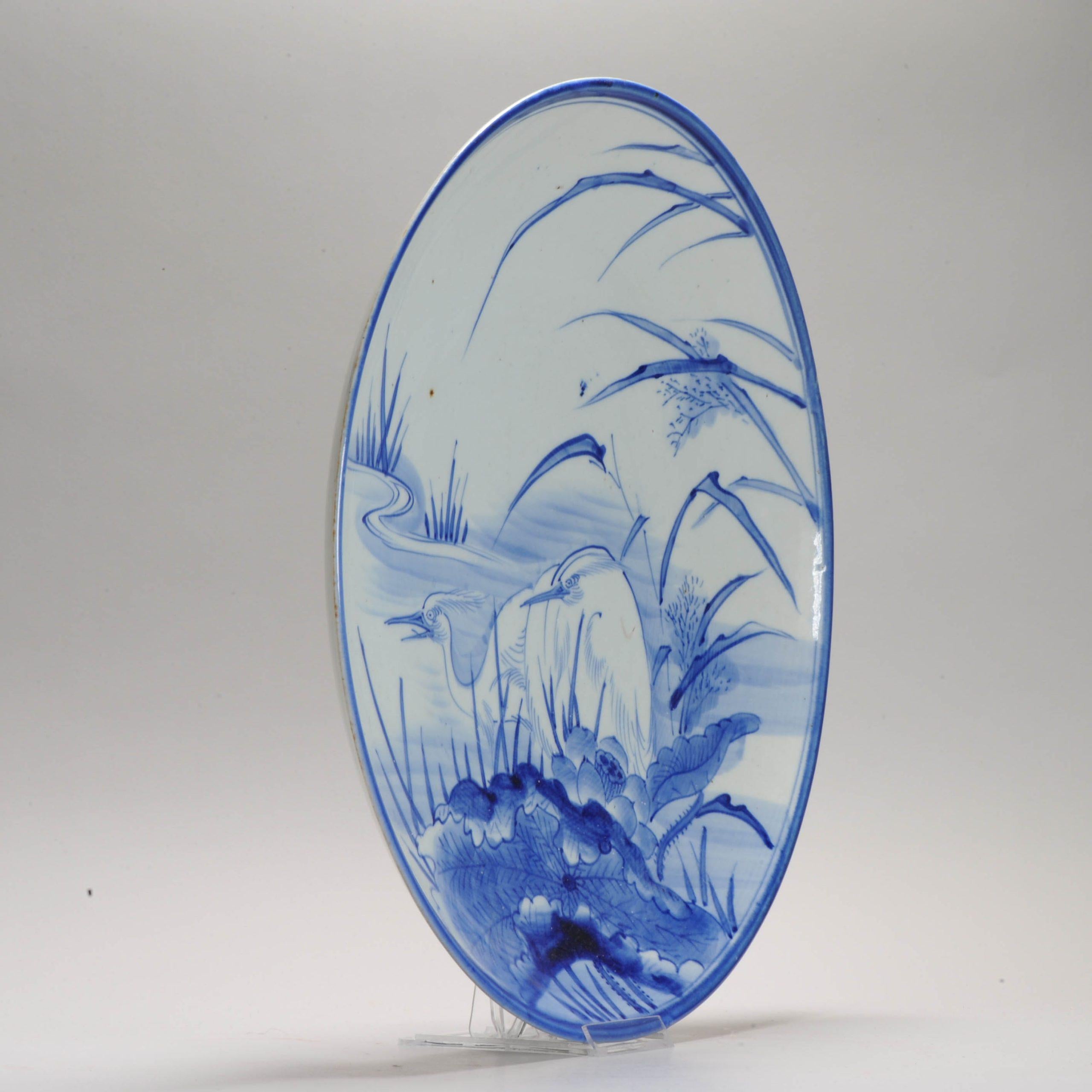 Sharing this very nice edo period, 1800, example. With a central scene of  2 cranes.

Additional information:
Material: Porcelain & Pottery
Japanese Style: Arita
Region of Origin: Japan
Period: 17th century, 18th century
Condition: