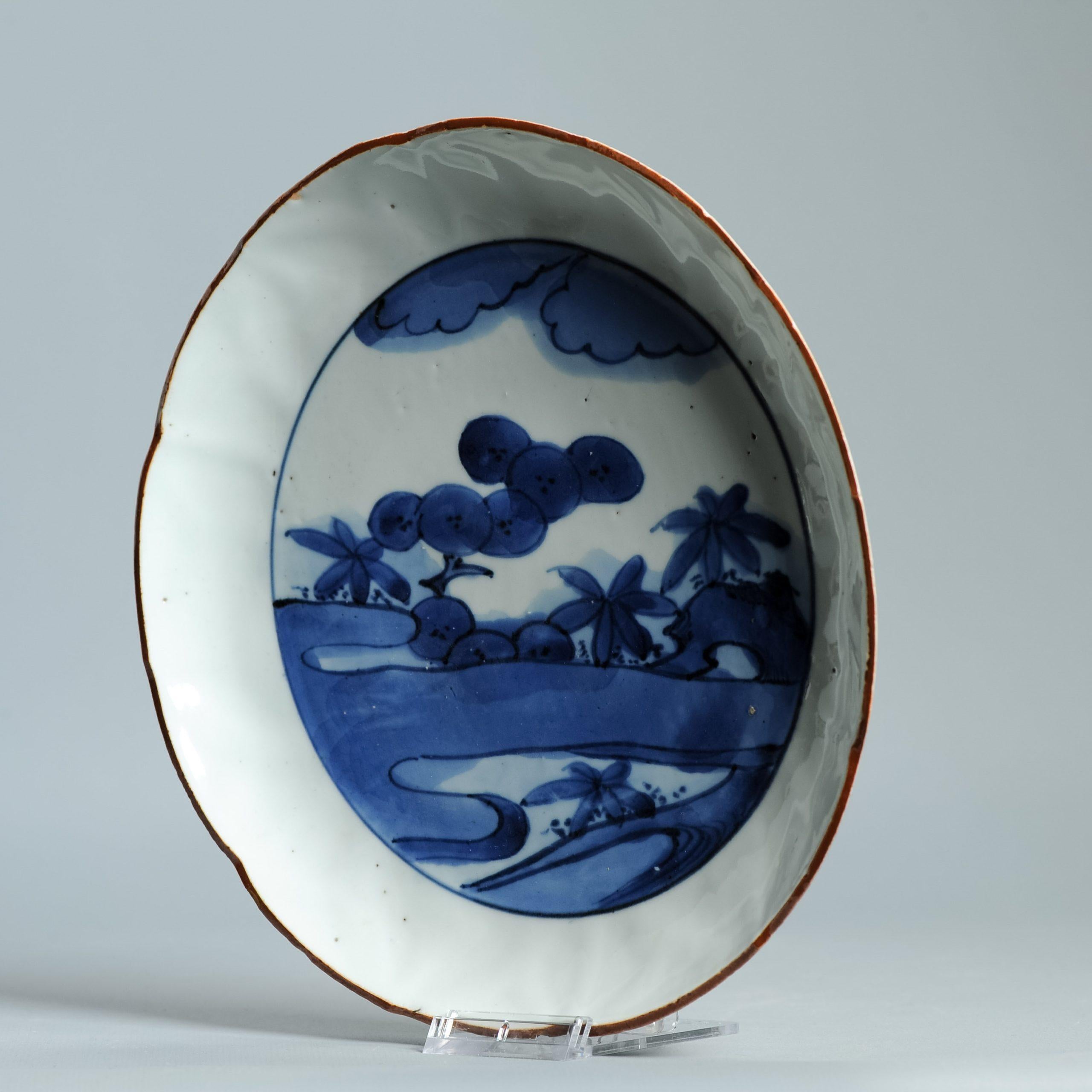 A Shoki-Imari Porcelain Dish, Arita Kilns c.1630 -1650.
Visible in the pictures is a flat dish with everted rim and its thick rough foot-rim is typical of some of the earliest Japanese porcelain ever produced. The dish is thickly potted, typical of