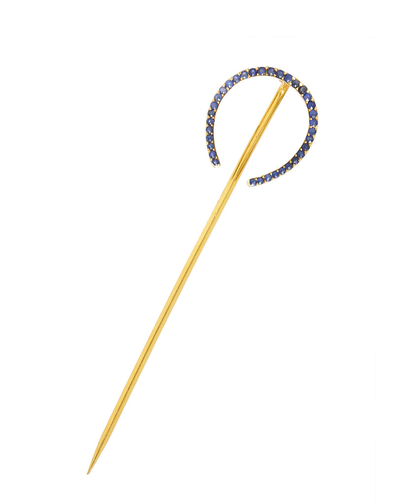 Stickpin features a horseshoe form with bead set sapphires weighing approximately 0.50 carats

Transparent and ranging from blue to denim blue with light to medium saturation

With scalloped gold profile

Tested as 18 karat gold

Circa: