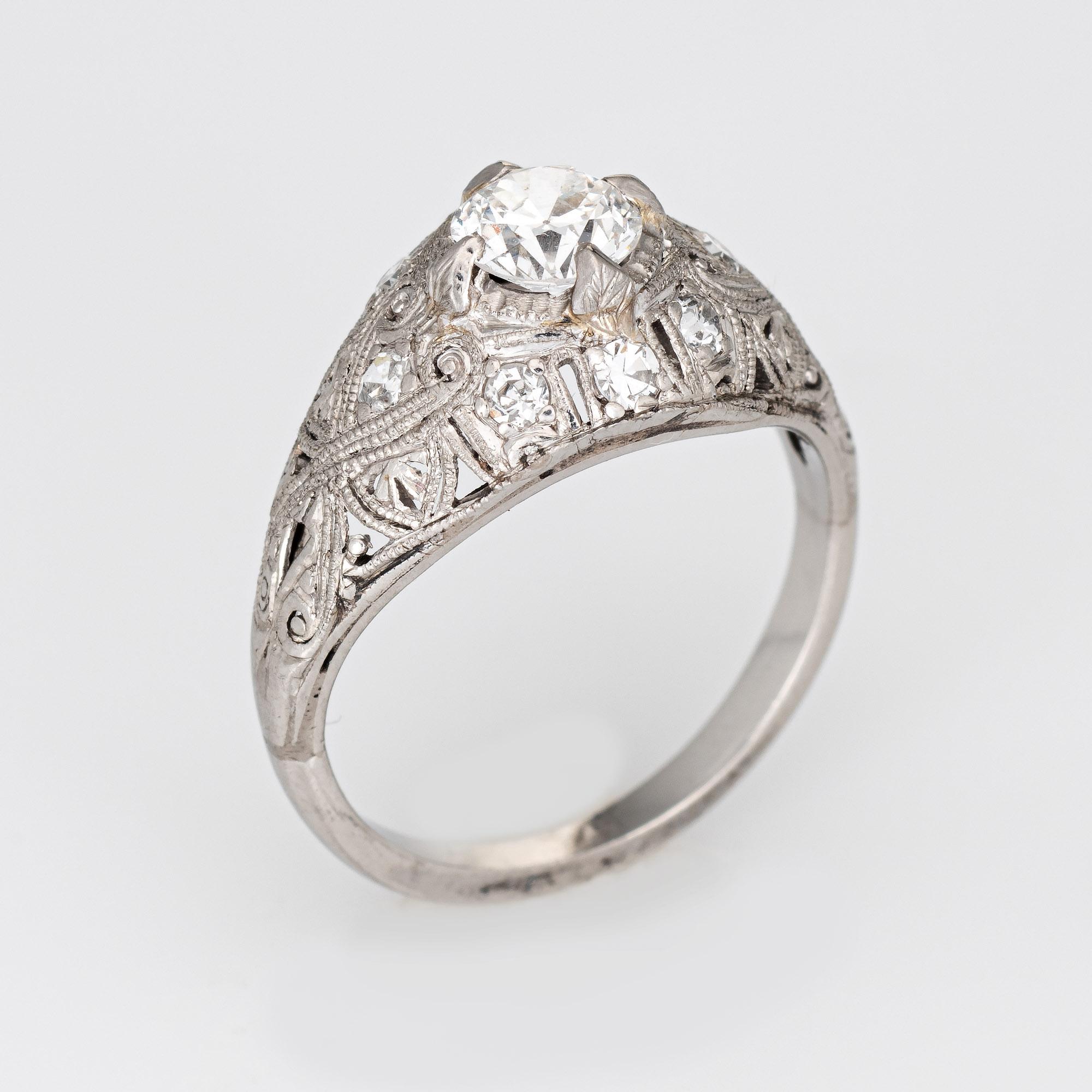 Finely detailed antique Edwardian diamond engagement ring (circa 1900s to 1910s) crafted in 900 platinum. 

Center set old European cut diamond is estimated at 0.55 carats (estimated at H-I color and VS2-SI1 clarity). 8 single cut diamonds total an