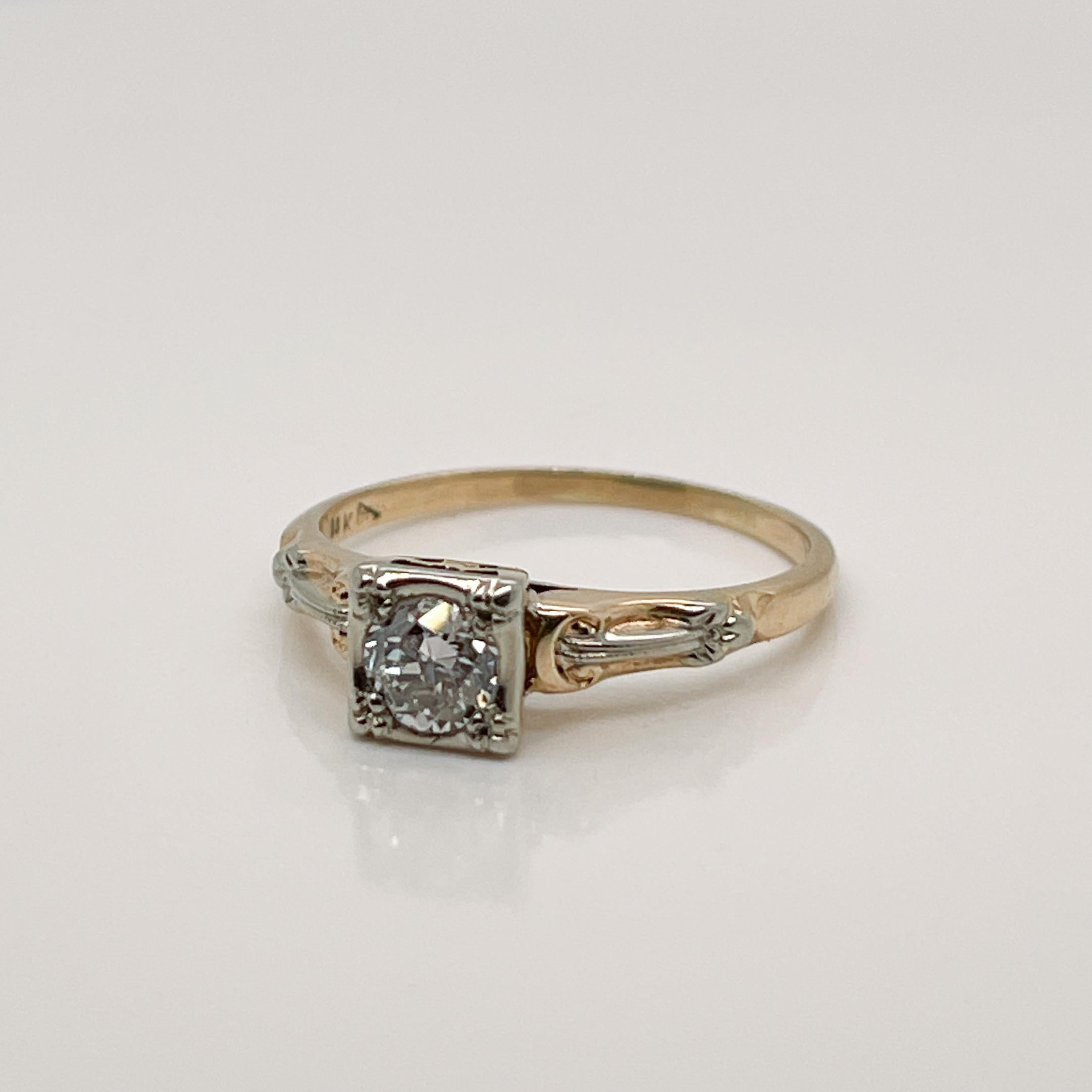 A very fine antique Edwardian 14 Karat gold and diamond engagement ring.

With a round brilliant cut diamond pave set in square setting. 

Embellished with platinum topped or white gold accent on the shoulder. 

Simply a terrific ring with a pretty