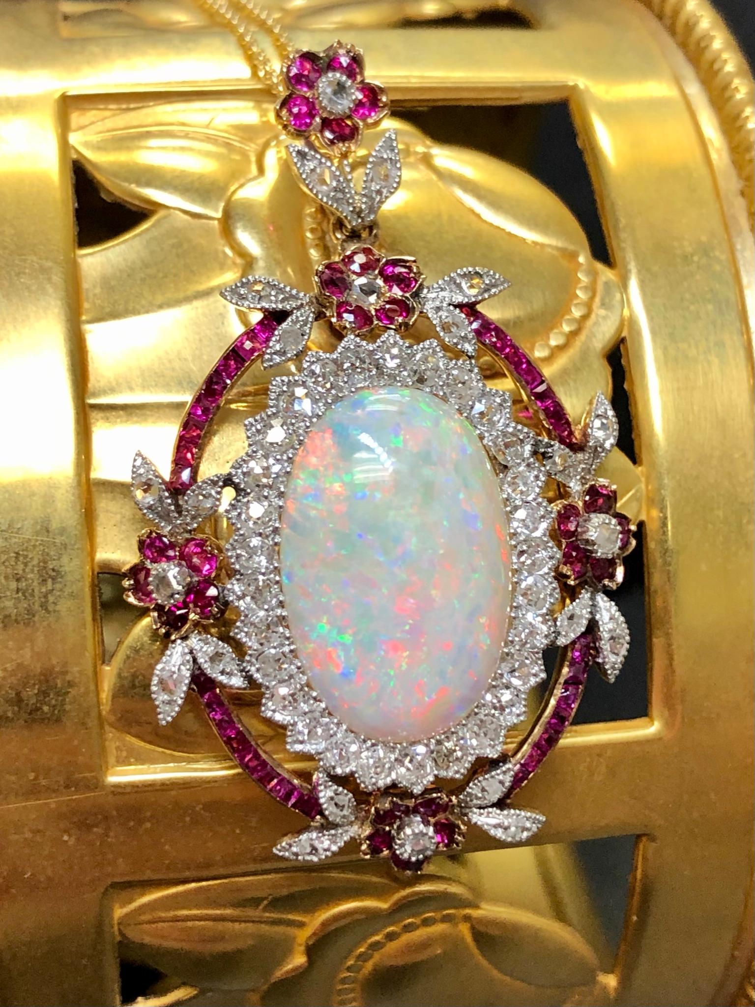 
An incredible example of the Edwardian period, this beautiful pendant is done in 14K gold and centered by an approximately 6.70ct (17.2mm x 11.13mm x 4.83mm) natural Australian opal which is also 100% free of crazing. Surrounding the center stone,