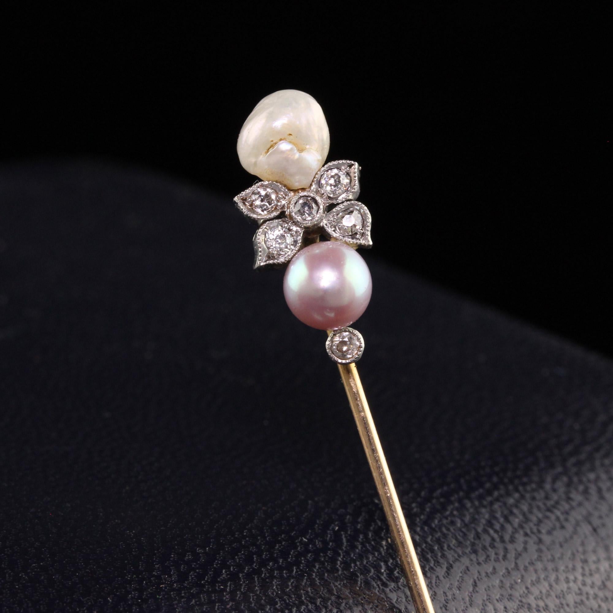 Beautiful Antique Edwardian 14K Yellow Gold and Platinum Natural Pearl Diamond Stick Pin. This beautiful pin is crafted in 14k yellow gold and platinum. The stick pin has a natural pearl above and below. One is a white hue and the other is a pink
