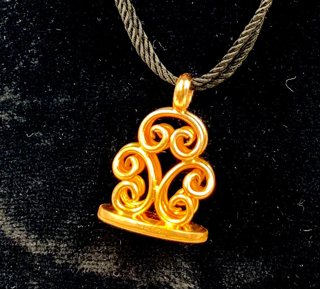 gold scroll pendant