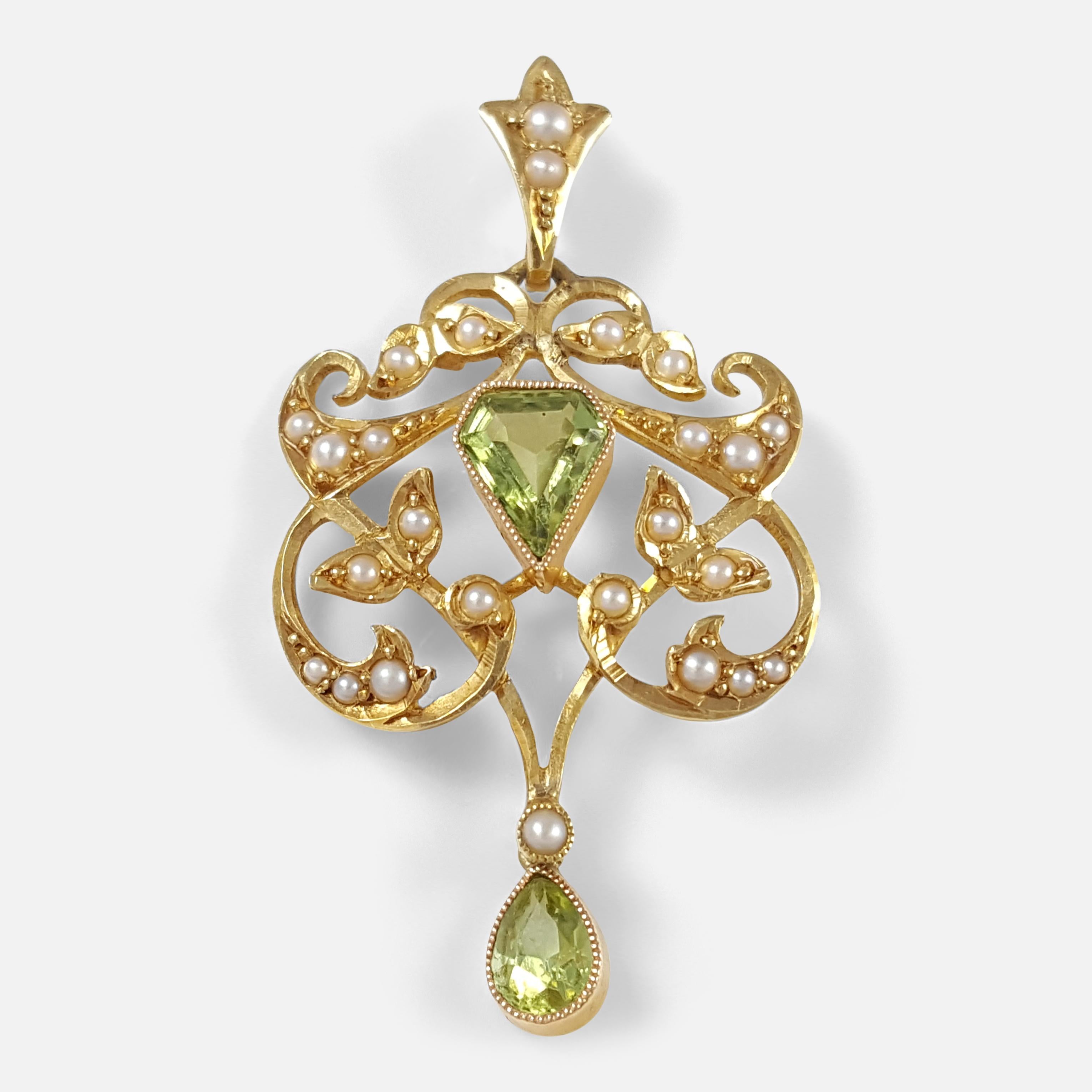 Description: - This is a fine antique Edwardian period 15 karat yellow gold peridot & seed pearl pendant. As was common for the period, the pendant is stamped '15ct' to denote 15 karat (carat) gold fineness. 

Date: - c1905.

Measurement: - The
