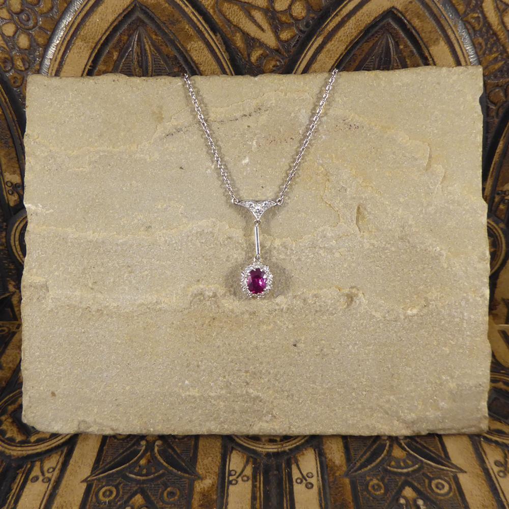 This gorgeous necklace has been hand crafted in the Edwardian era, with a beautiful bright 1.50ct Ruby surround by 10 Round Cut Diamonds sparkling from all angles. Above the cluster sits the drop with a Diamond adorned arrow shape leading to the