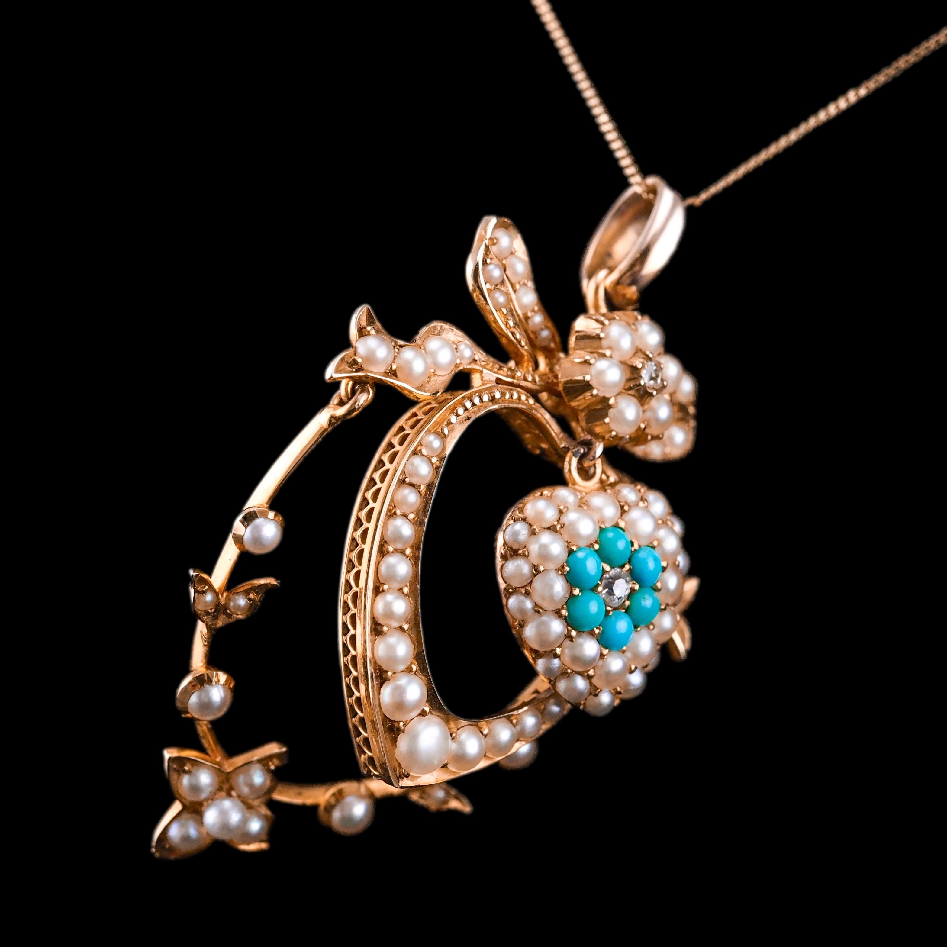 We are delighted to offer this spectacular antique Edwardian 15ct gold turquoise, diamond and pearl pendant necklace made c.1910.
 
Apparent upon a quick glance, this pendant presents an exquisite & elegant bow and heart-shaped Edwardian design that