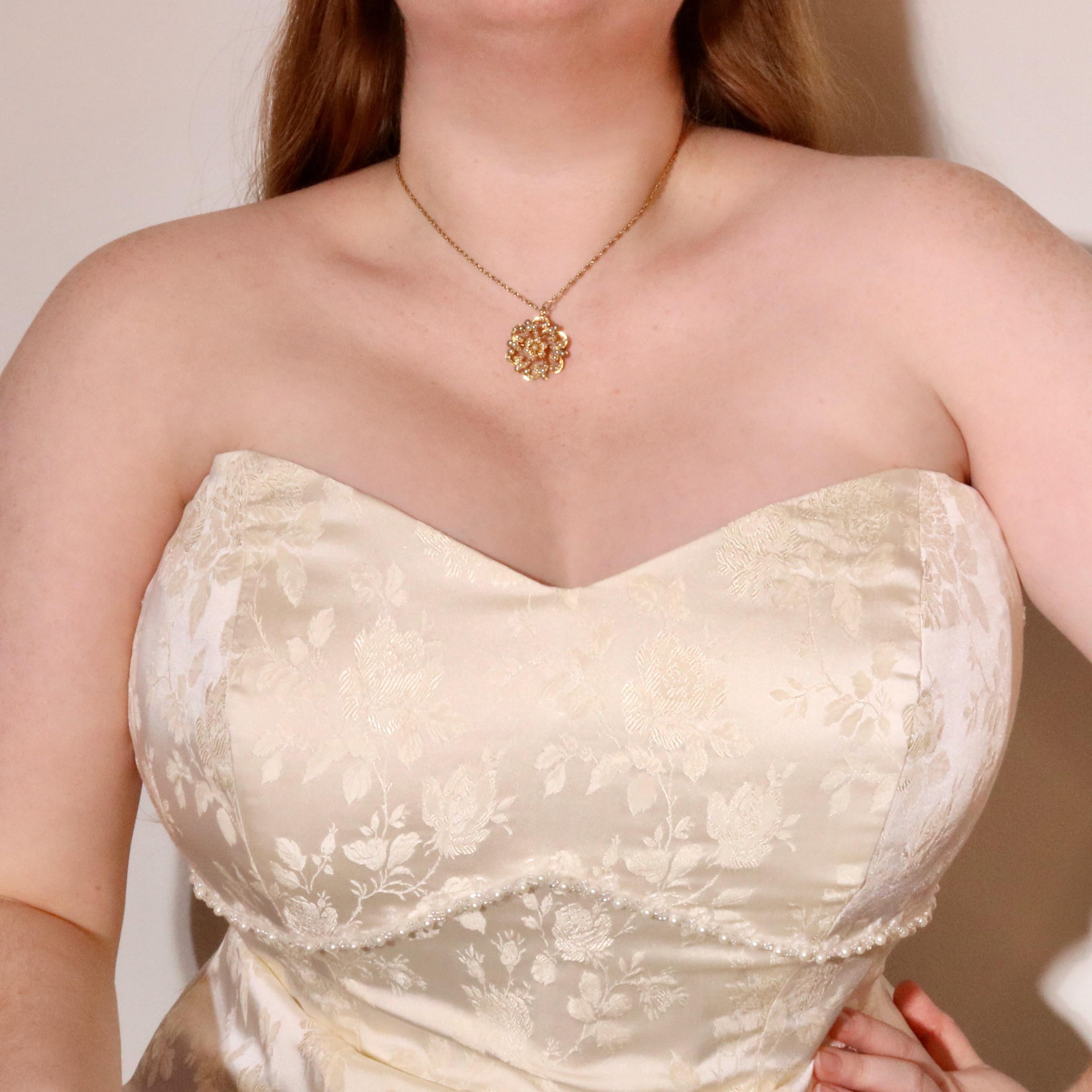 An Edwardian, pearl, and yellow gold brooch, comprising sixty half seed pearls, and one whole seed pearl, set in 15 karat yellow gold, with 15 karat yellow gold pin and fittings. 

This delightful Edwardian jewel is wearable as both a pendant and a