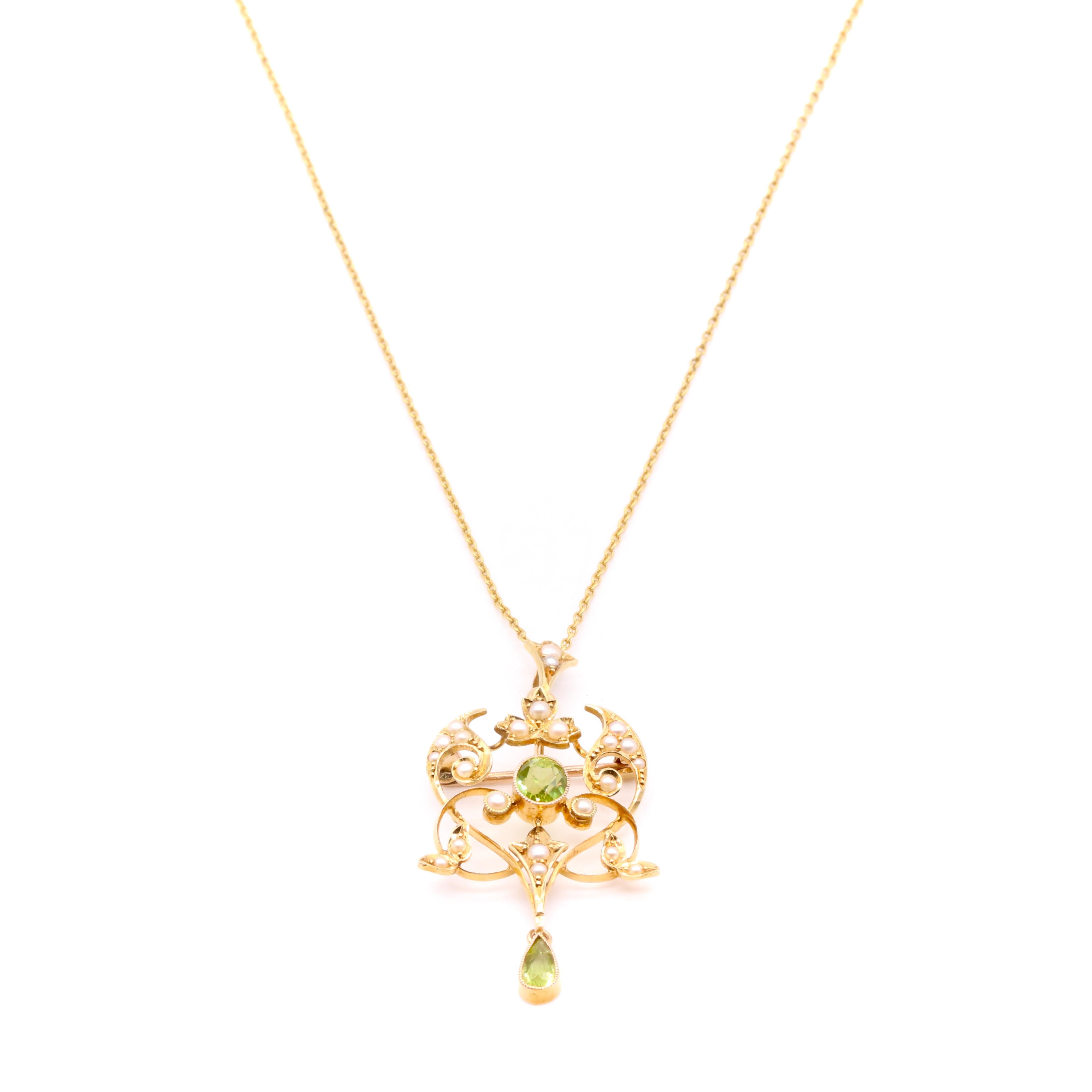 A late Victorian / early Edwardian peridot, pearl, and yellow gold pendant or brooch, comprising one oval-shaped peridot, and one pear-shaped peridot, and twenty-three half seed pearls, in 15 karat yellow gold. 

My favourite thing about this