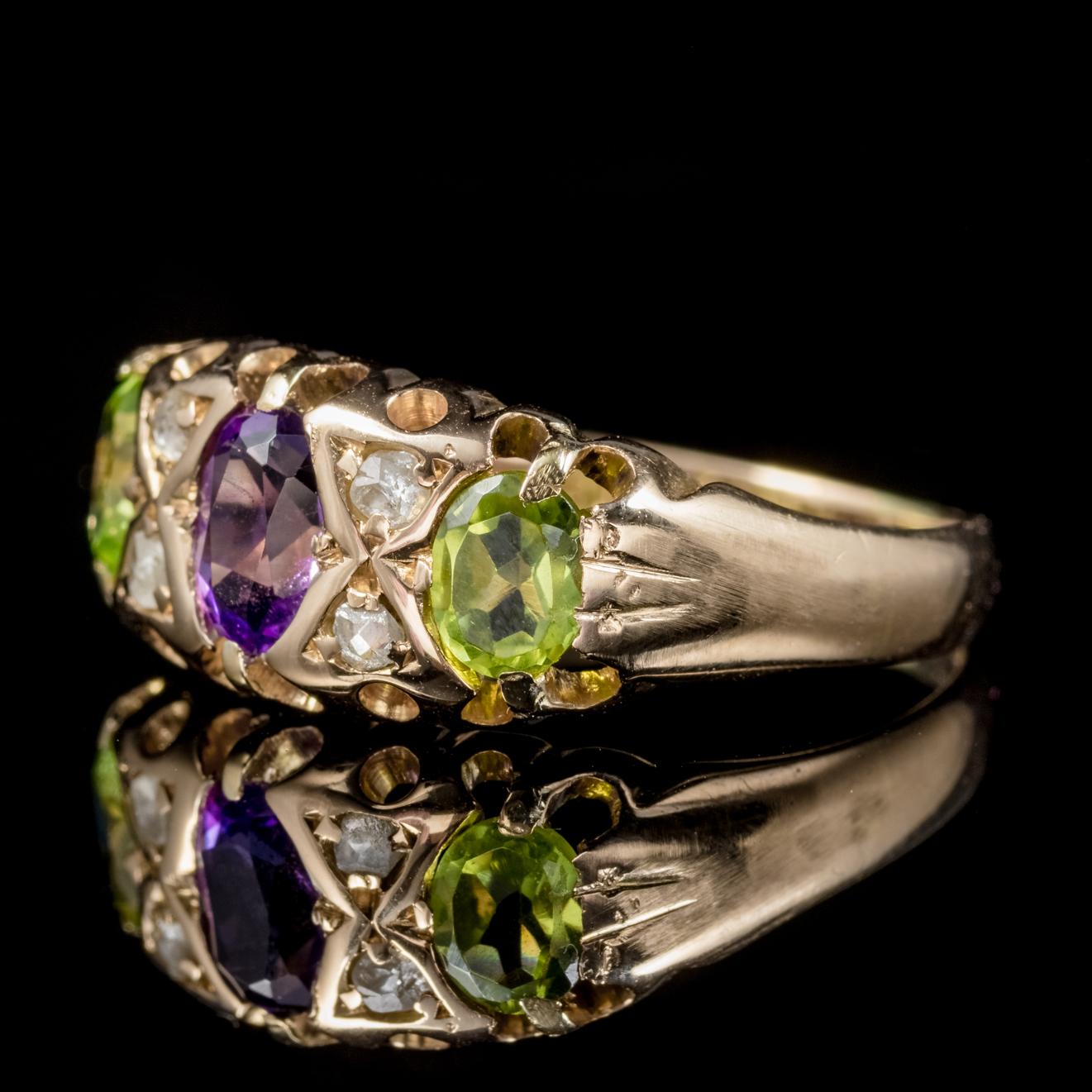 A fabulous antique Edwardian Suffragette ring which is fully hallmarked Birmingham 1915. 

The lovely ring is set with 0.50ct violet Amethyst with four sparkling Diamonds and two rich green Peridots at either side. 

Suffragettes liked to be