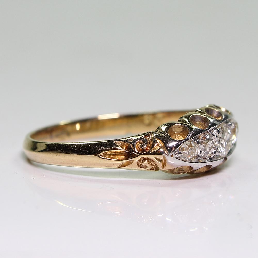 Period: Edwardian (1901-1920)
Composition: 18K gold.
Stones:
•	5 Old mine cut diamonds of H-VS2/SI1 quality that weigh 0.50ctw.
Ring size: 8  
Ring face:  15mm by 7mm 
Rise above finger: 3mm.¬
Total weight:  3.2grams – 2.1dwt

This purchase comes