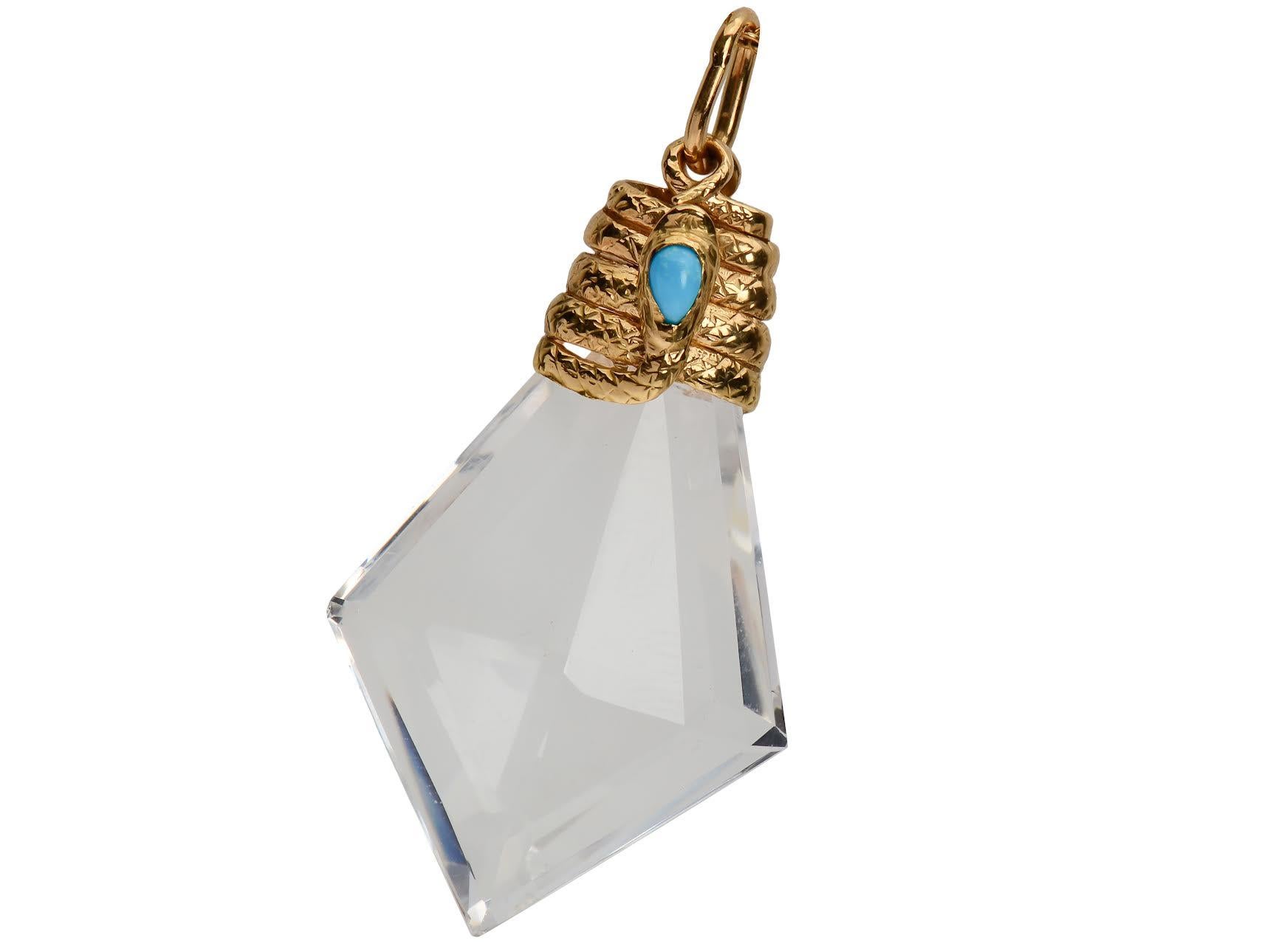 An 18 Kt gold serpent set with a turquoise wraps around the top of this icy clear rock crystal prism creating a talisman you will treasure. The crystal is strikingly faceted into an elongated diamond shape. The size and proportions are perfect. Rock