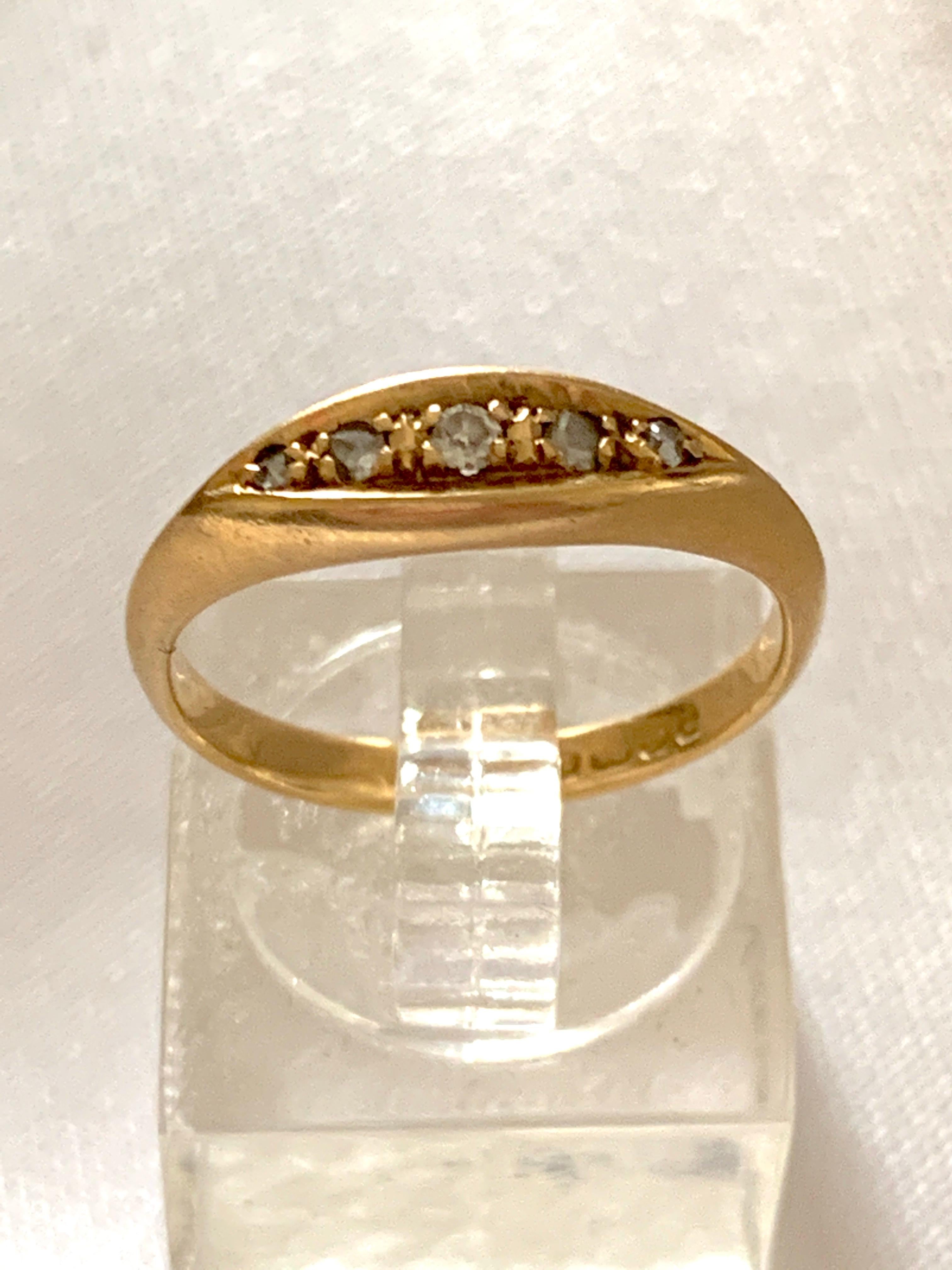 Antique Edwardian 18ct Gold diamond Ring
Fully Hallmarked
Crown, Birmingham Assay. 18 , and letter U - 1919
Old mine cut diamonds

Diamond surface diameters
1.15 mm x 2 = 0.015 x 2 = 0.03   Carat
1.75 mm x 2 = 0.020 x 2 = 0.04   Carat
2.15 mm x 1 =