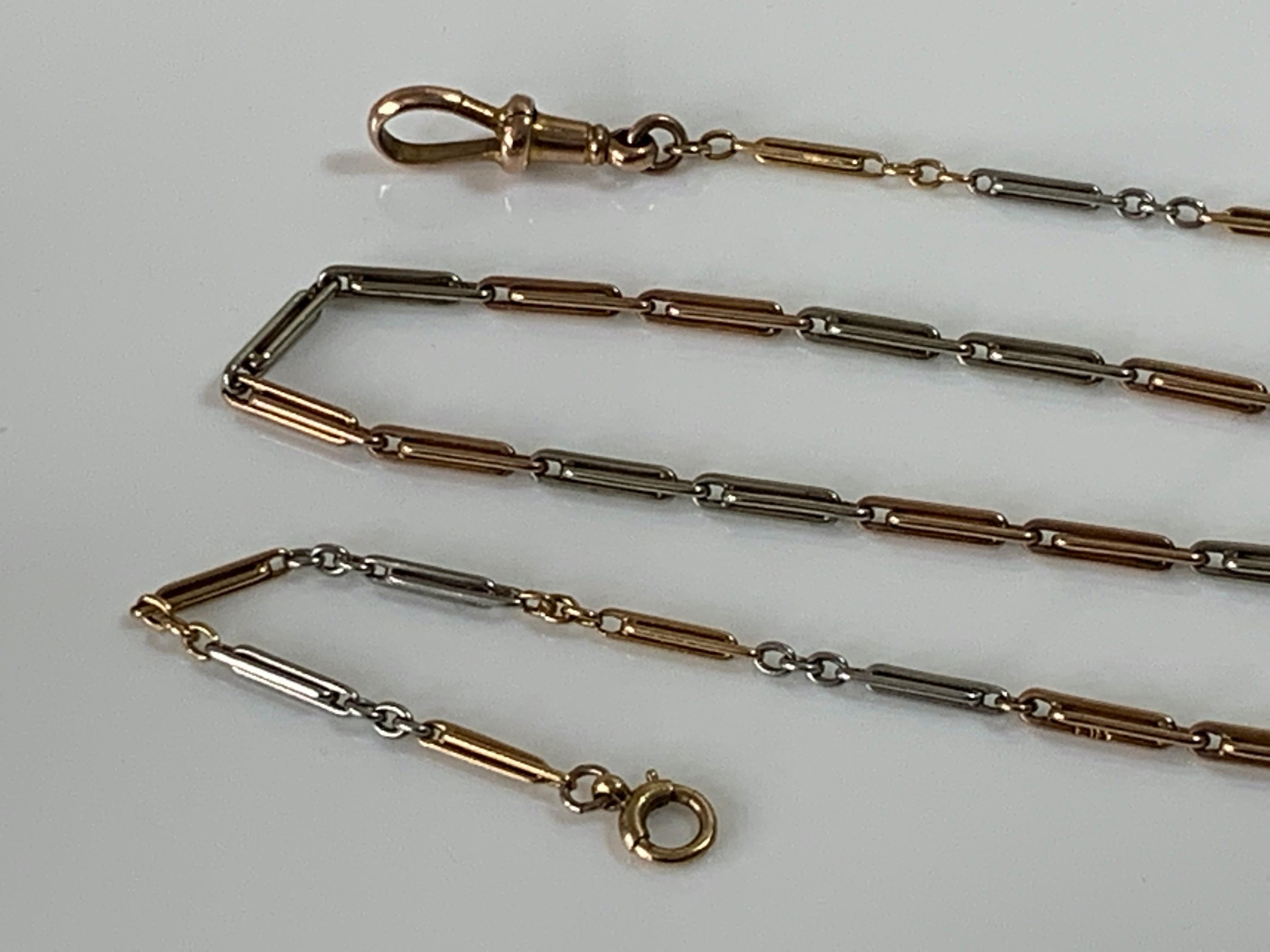 Antike Edwardian 18ct Gold & Platin Kette 
Die letzten drei Glieder aus 18-karätigem Gold an jedem Ende sind aus gelbem 18-karätigem Gold 
alle anderen sind aus 18 Karat Roségold und Platin
Zwei Glieder sind mit dem Hersteller W.H ? gestempelt
und