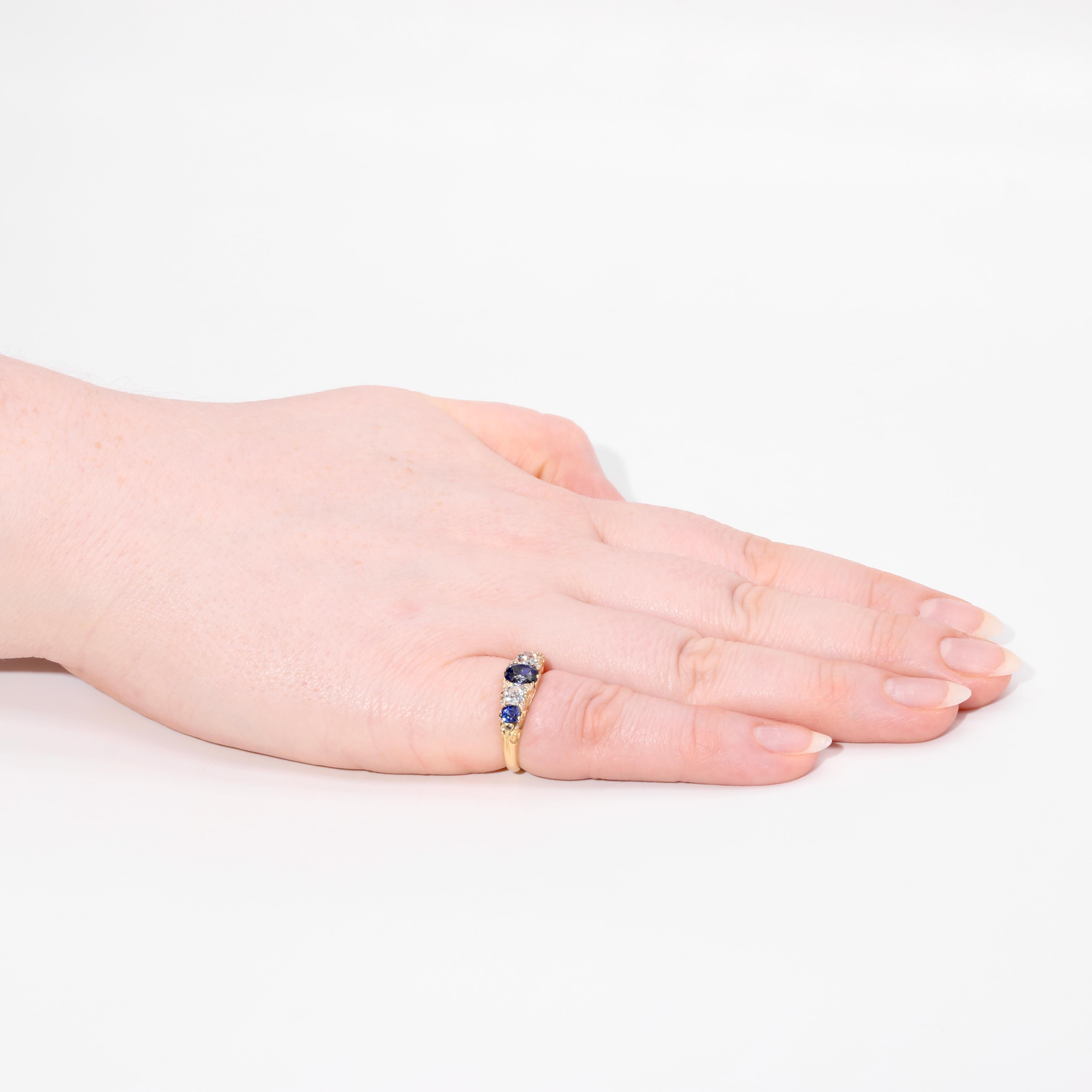 An Edwardian sapphire, diamond, and yellow gold ring, comprising one large cushion shaped sapphire, two round cut sapphires, two old European cut diamonds, and ten rose cut diamonds, in 18 karat yellow gold. 

This beautiful ring is set to the