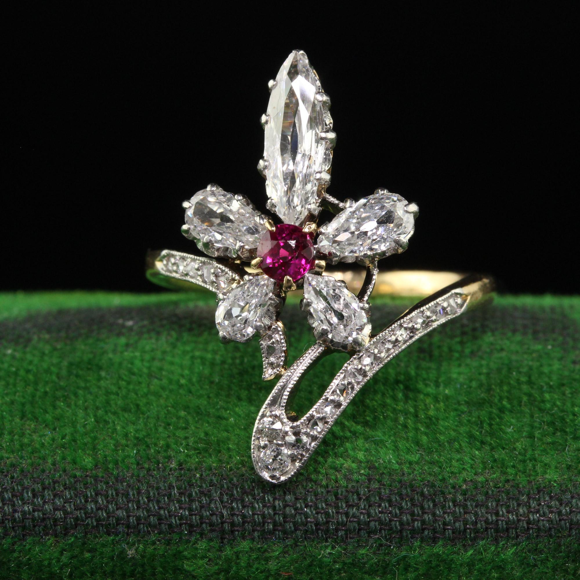 Beautiful Antique Edwardian 18K Gold and Platinum Old Marquise Diamond Ruby Cocktail Ring. This incredible Edwardian diamond ring is crafted in 18k yellow gold and platinum top. This ring features old cut marquise and pear shape diamonds that are